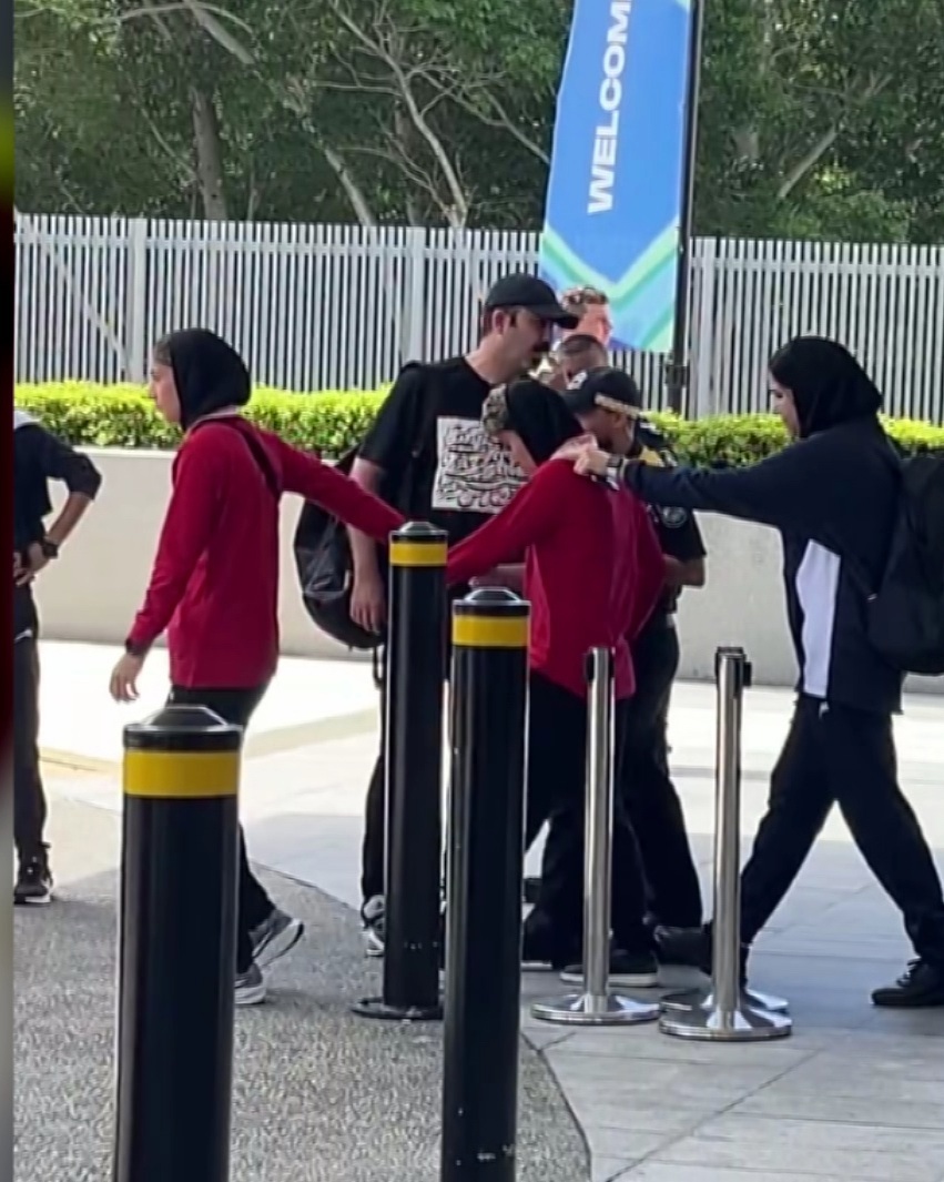 Protesters have tried to block a bus taking the Iranian women's football team from their hotel on the Gold Coast to the airport and out of Australia after five members of the side who escaped their handlers were granted asylum by the federal government. Members of the team appeared to pull one player towards the bus as the team﻿ left the RACV Royal Pines Resort this afternoon.