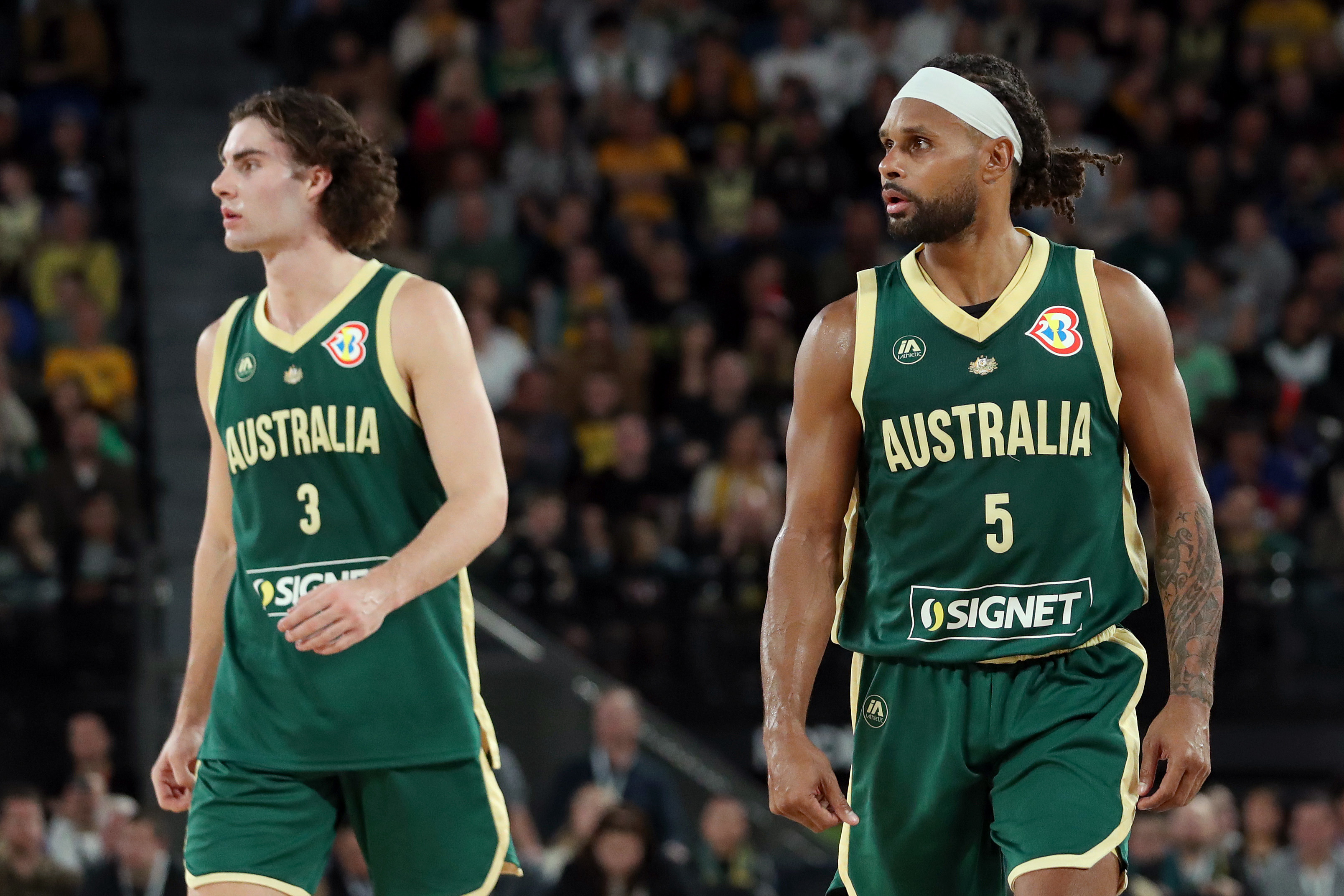 Patty Milles and Josh Giddey of Australia.