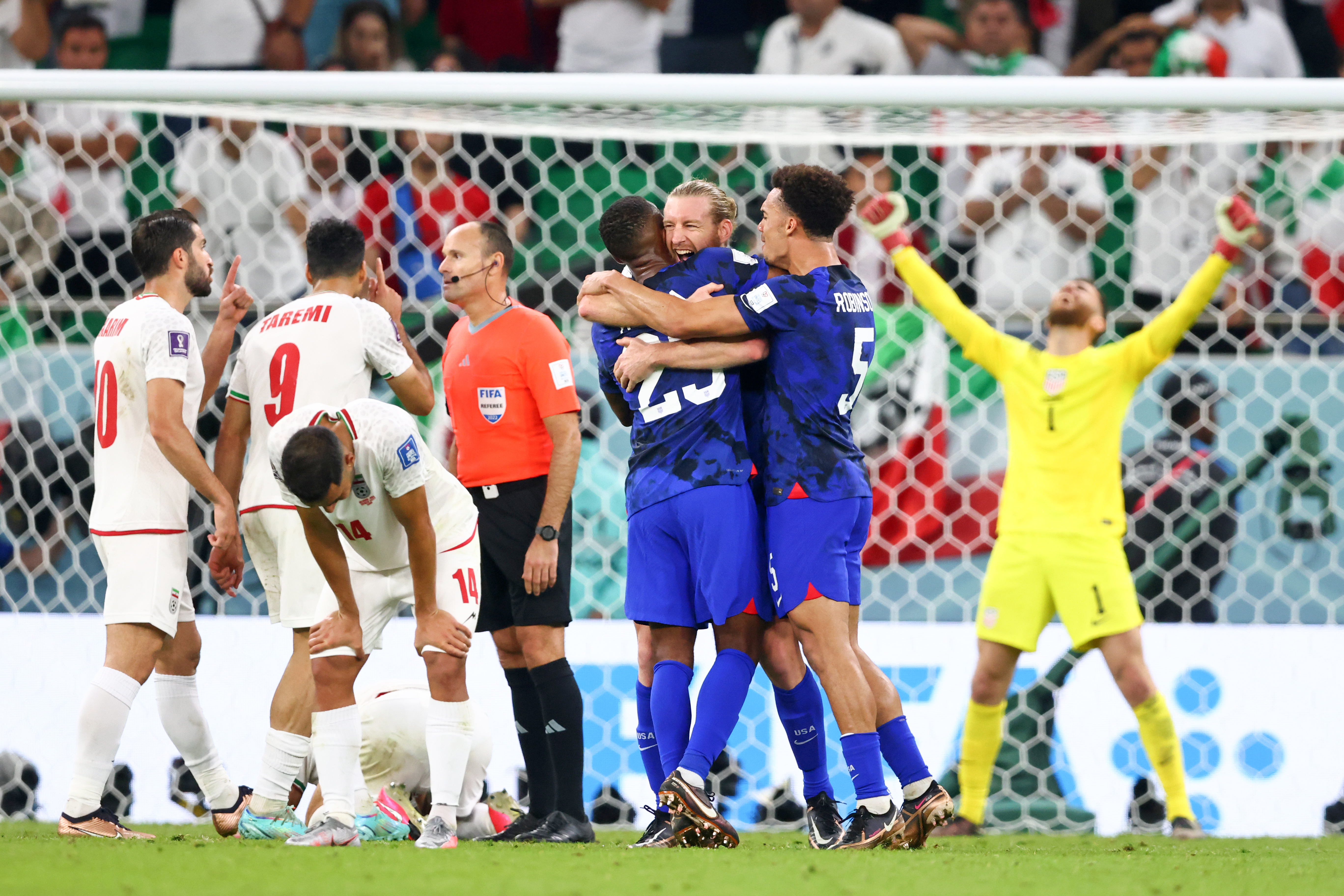 DOHA, QATAR - NOVEMBER 29: Walker Zimmerman of USA, Kellyn Acosta of USA and Antonee Robinson of USA celebrate after their sides victory after  the FIFA World Cup Qatar 2022 Group B match between IR Iran and USA at Al Thumama Stadium on November 29, 2022 in Doha, Qatar. (Photo by Stefan Matzke - sampics/Corbis via Getty Images)