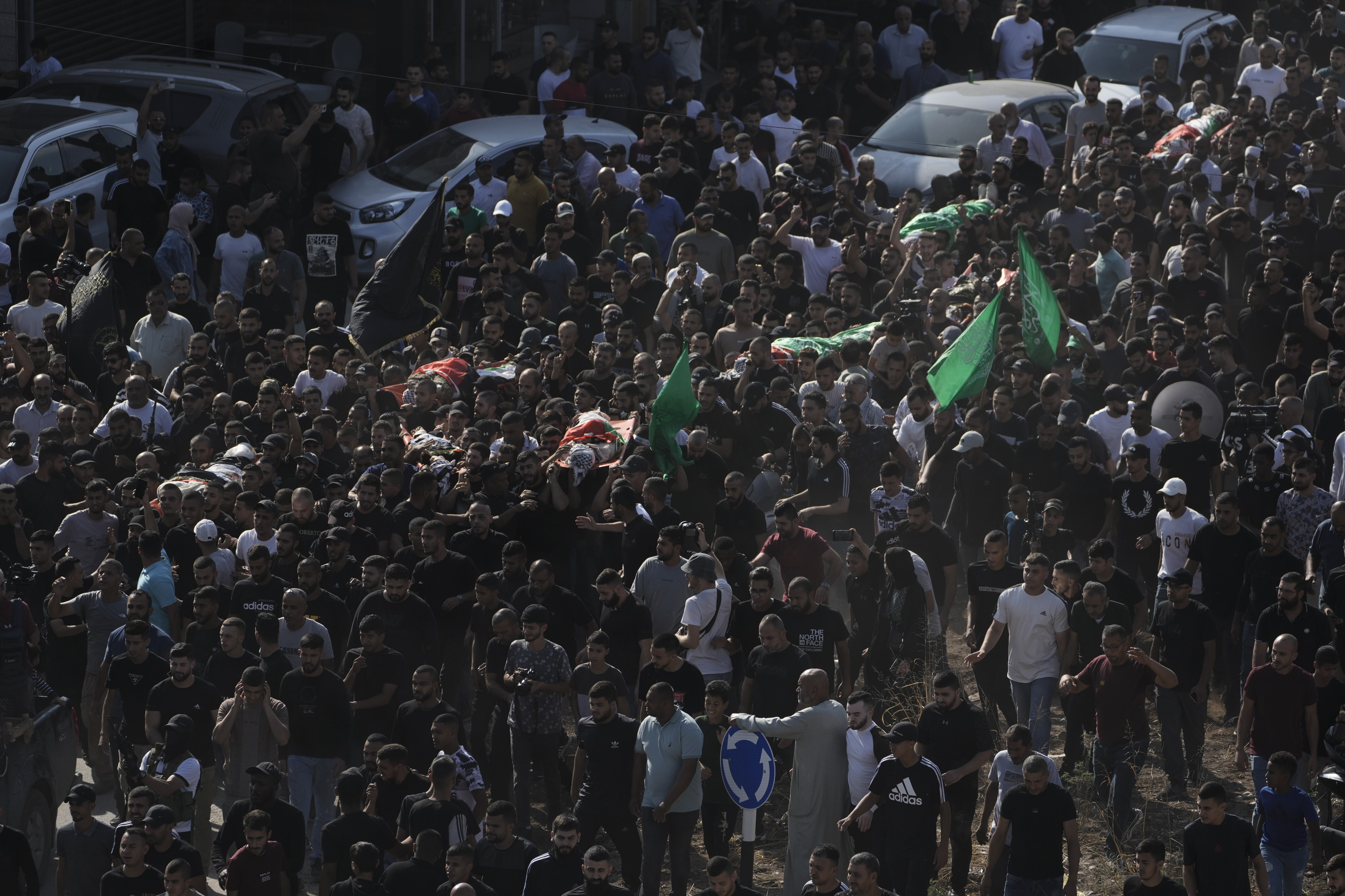 Palestinias attend a funeral of people killed during an Israeli military raid on a Palestinian refugee camp, Nur Shams, in the West Bank on Friday, Oct. 20, 2023.