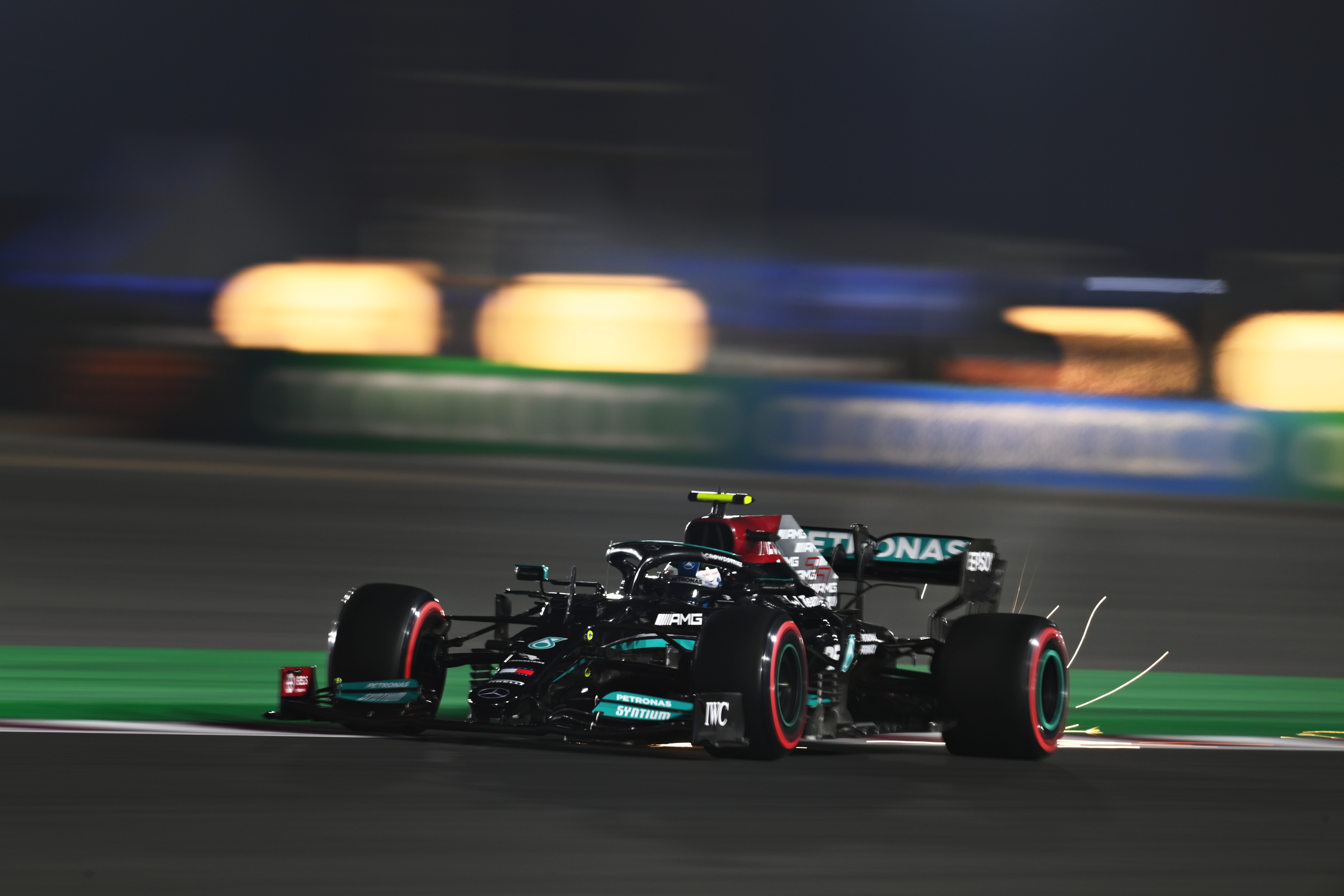 Sparks come from Valterri Bottas' Mercedes.