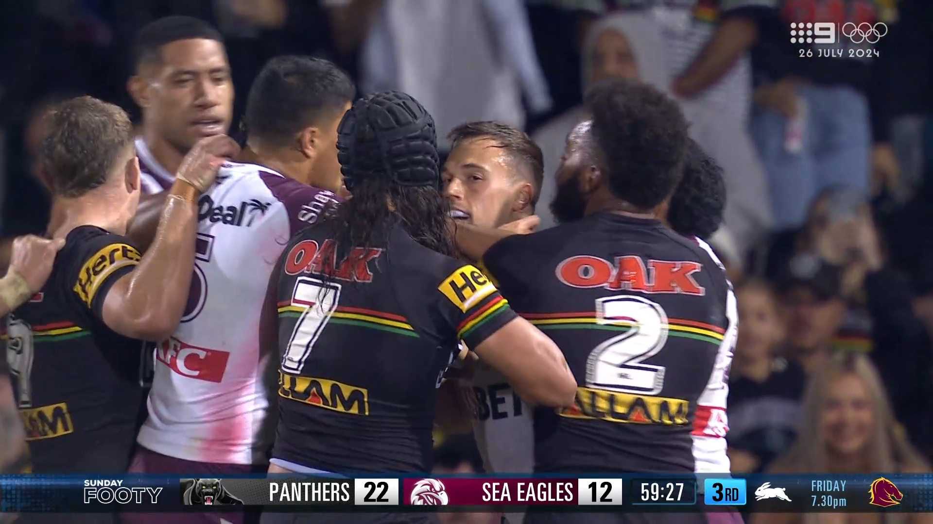 Luke Brooks and Jarome Luai separated by teams after a heated exchange.