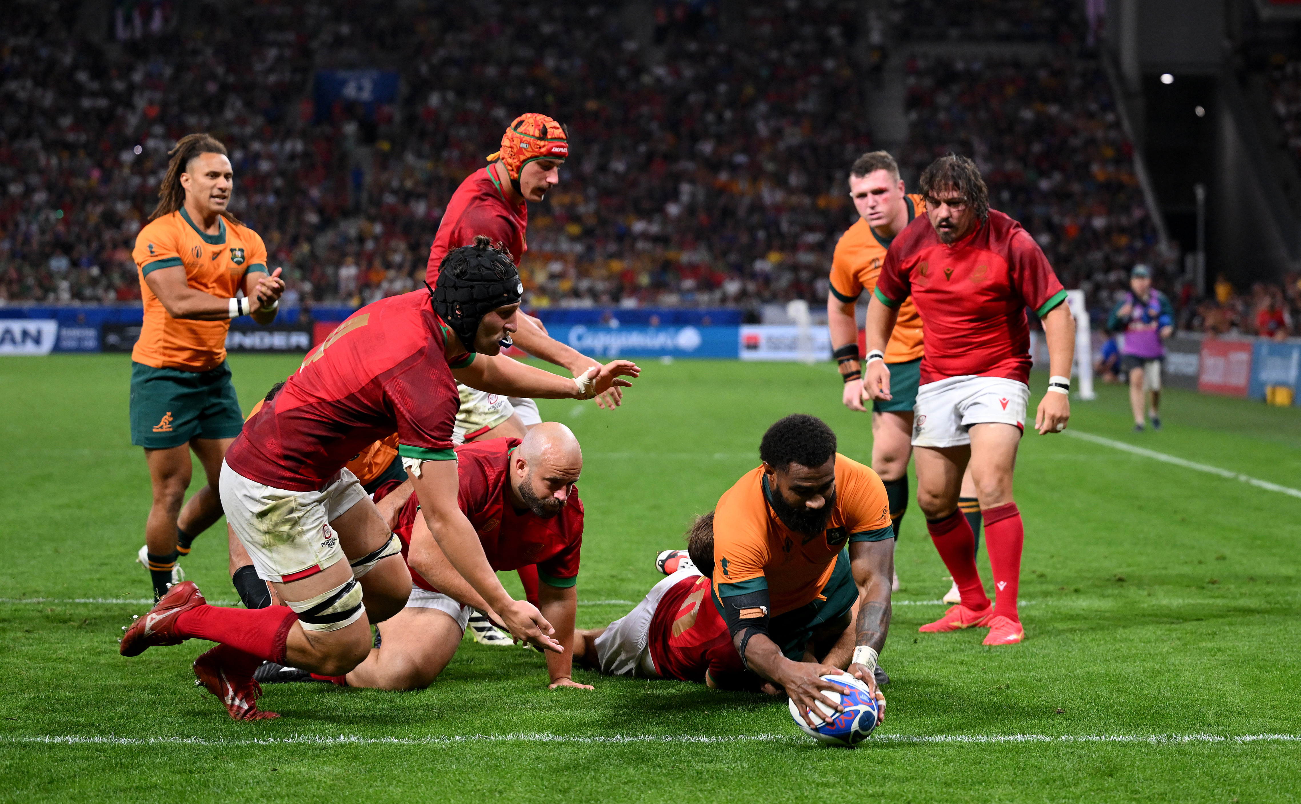 Marika Koroibete of Australia scores his team's fifth try.