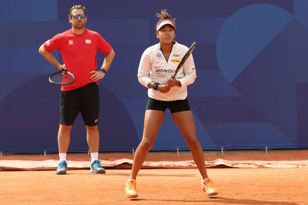 Naomi Osaka of Japan and her coach Wim Fisette during a training session ahead of the Paris 2024 Olympic Games.