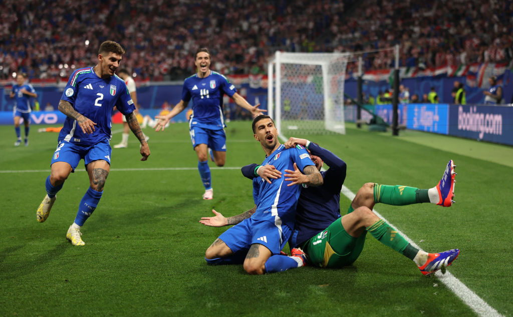 Mattia Zaccagni of Italy celebrates with teammates after scoring his team's first goal to equalise during the UEFA EURO 2024 group stage.