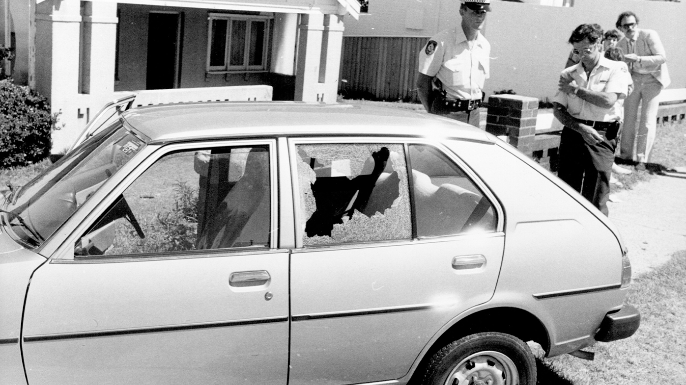 A policemen stands guard over the with Consuler Corps licence plates which was being driven by the bodyguard. December 17, 1980.