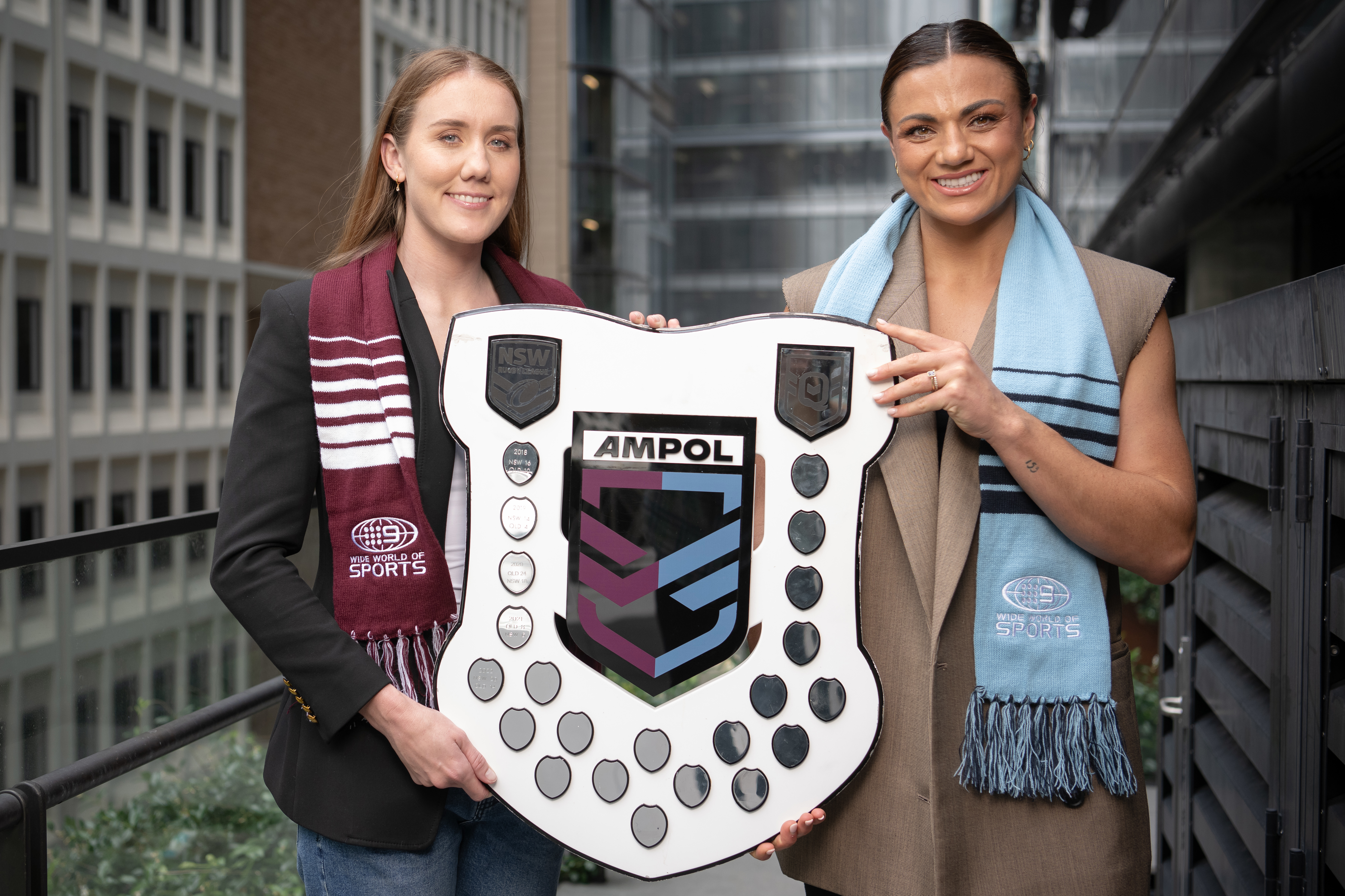 Tamika Upton (L) and Millie Elliott (R) pose with the Women's State of Origin shield