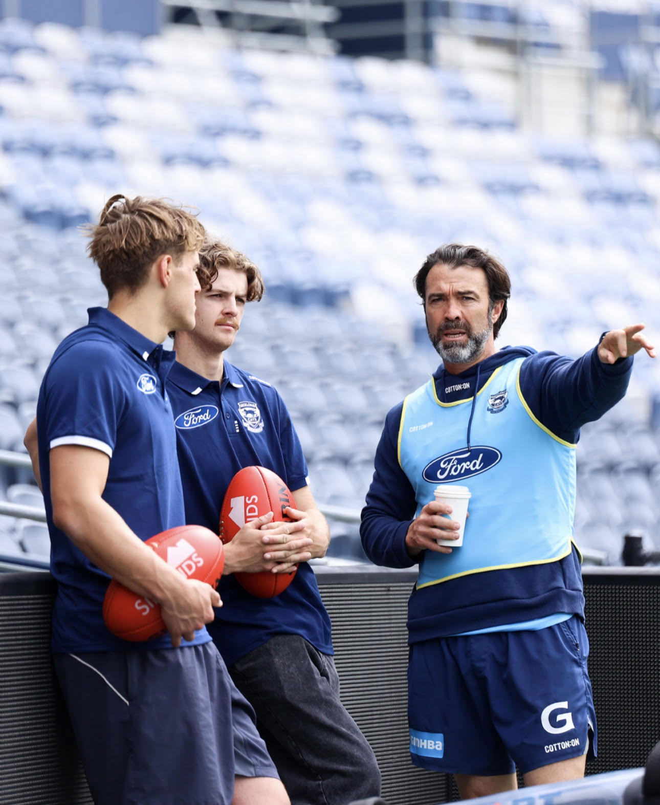 Cats new recruits with coach Chris Scott.