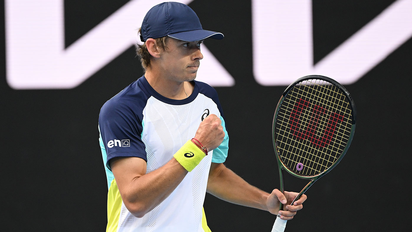 Alex De Minaur of Australia reacts after winning a point in his first round singles match against Lorenzo Musetti of Italy