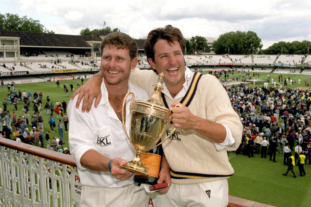Hampshire captain Mark Nicholas (R) and Robin Smith (L) celebrate with the Benson and Hedges Cup in 1992.