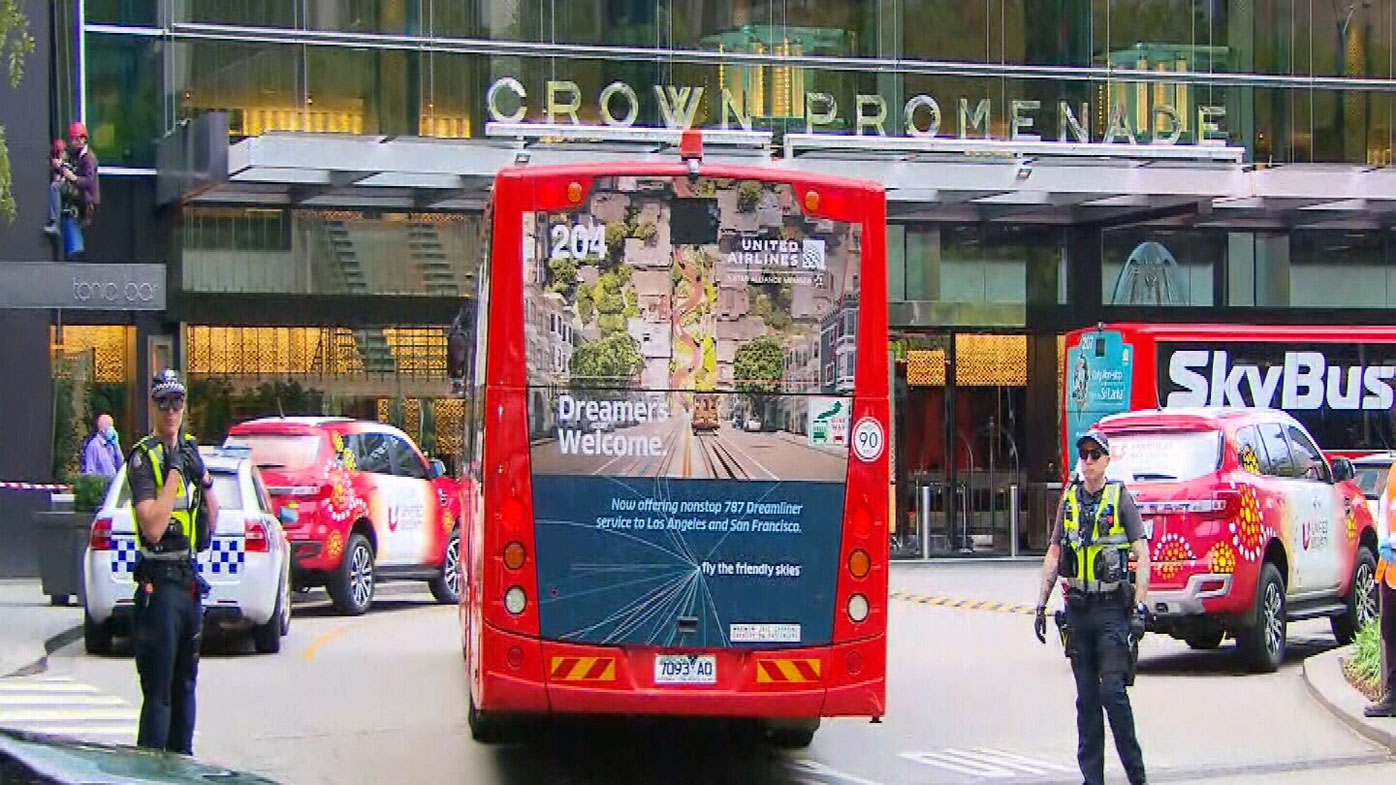 A bus of new arrivals into Australia are ferried into the Crown Promenade in Melbourne.