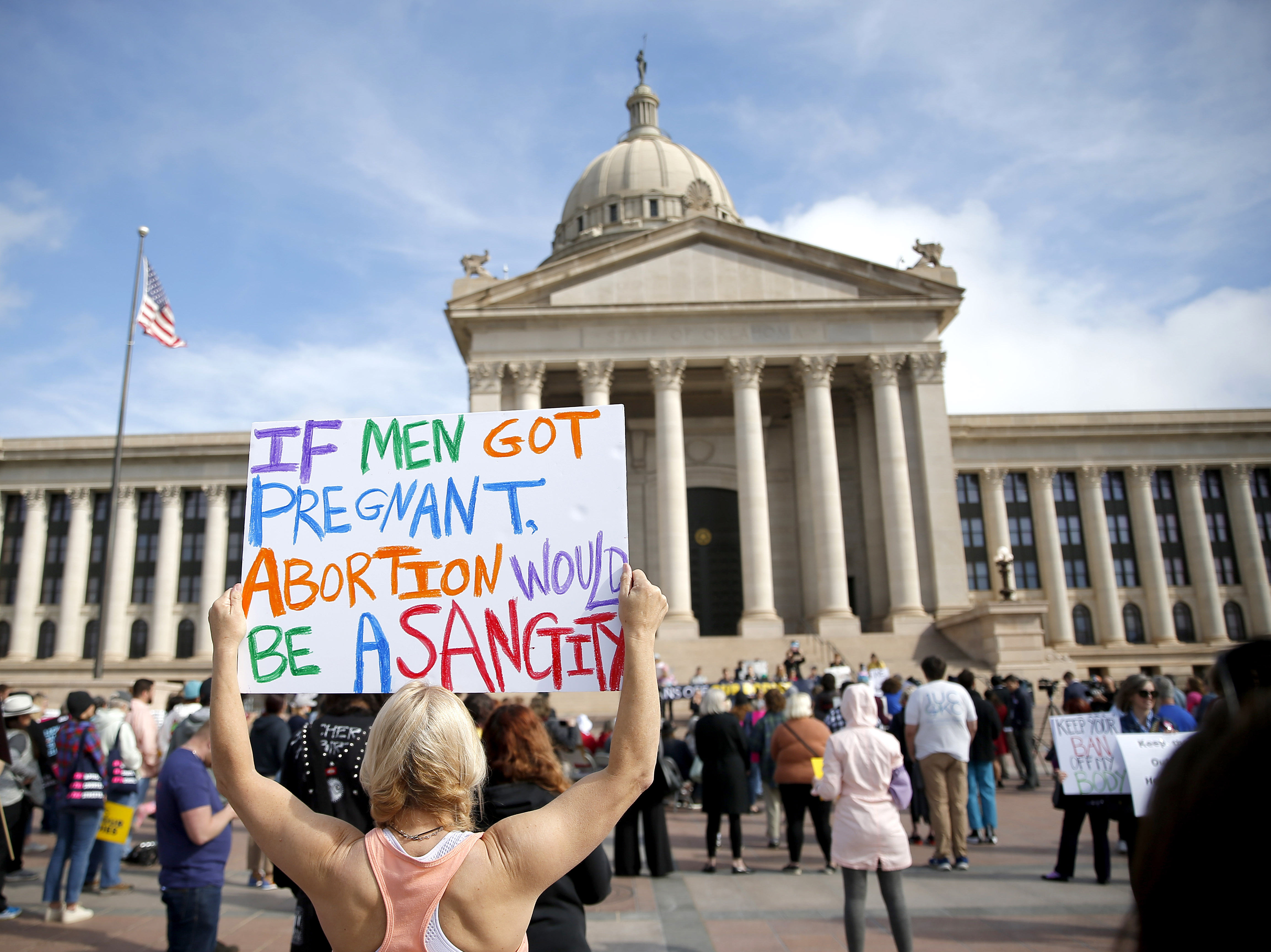 A person holds a sign during the Bans Off Oklahoma Rally on the steps on Oklahoma state Capitol to protest against the state's abortion bill.