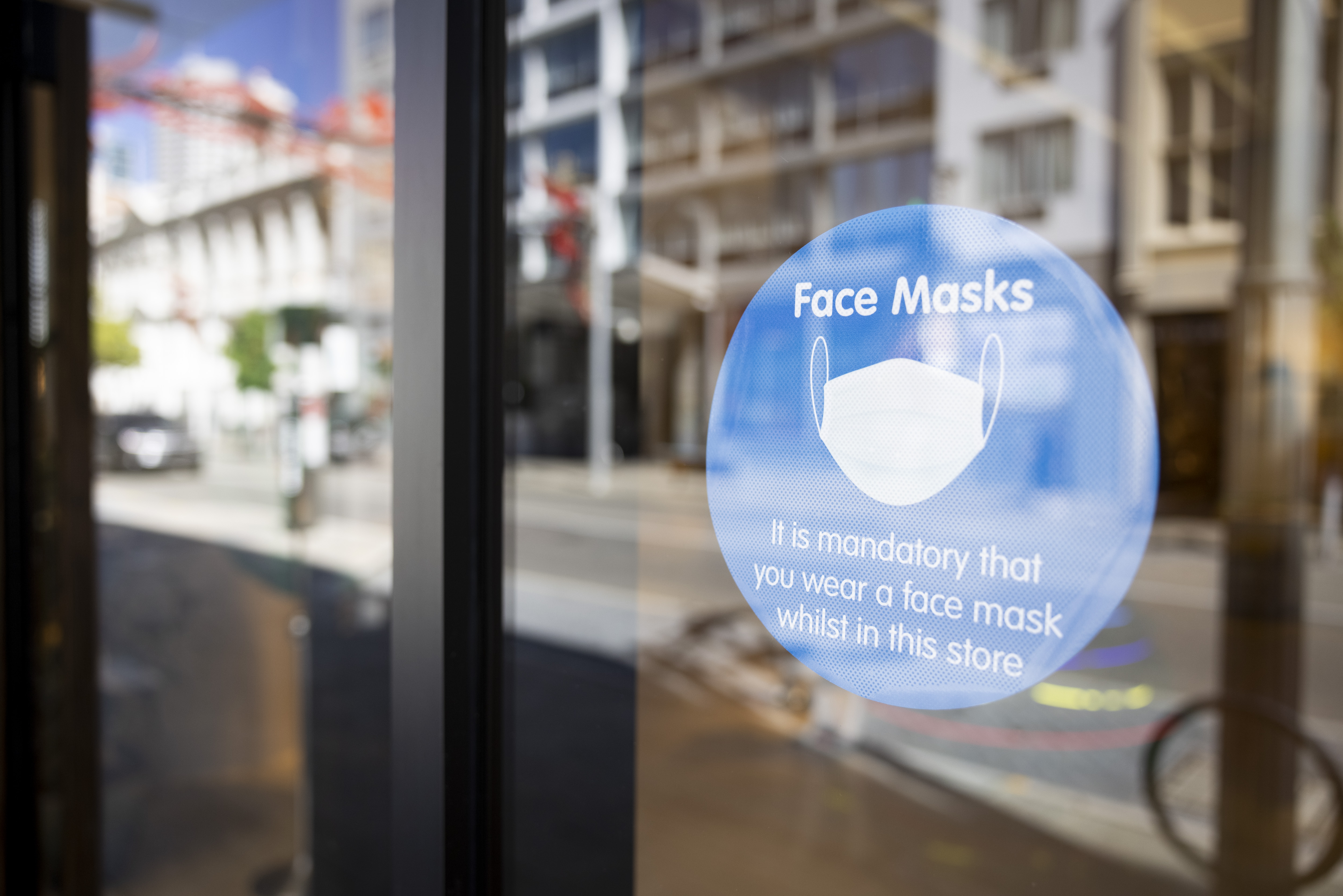A sign on display advises the public to the requirements of face masks.