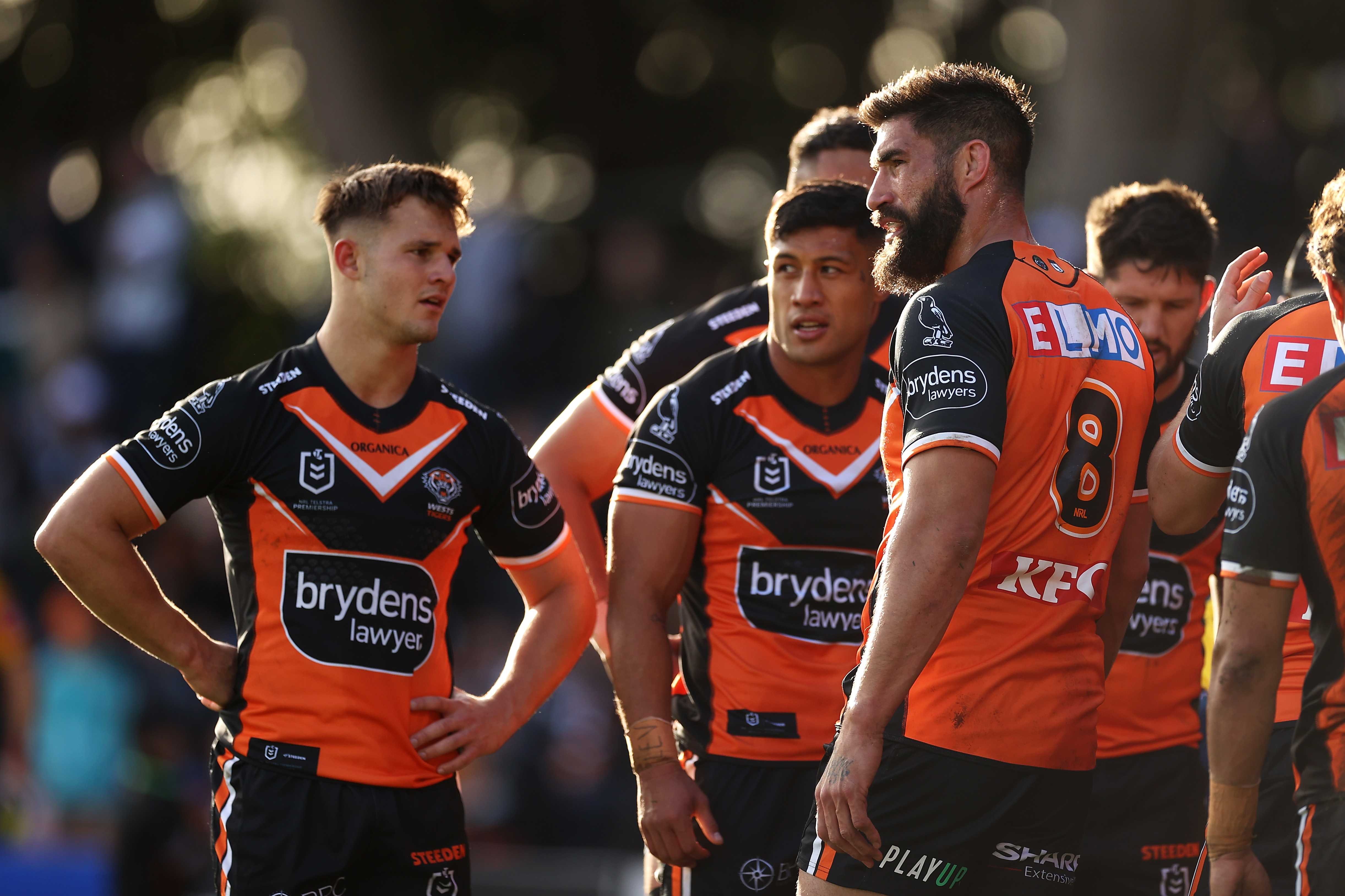 James Tamou of the Tigers and his team look dejected after a try to the Raiders.