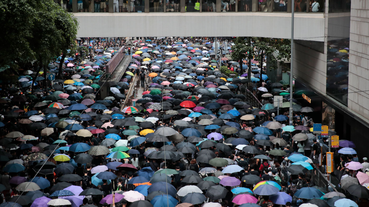 Millions of pro-democracy protesters march in central Hong Kong.