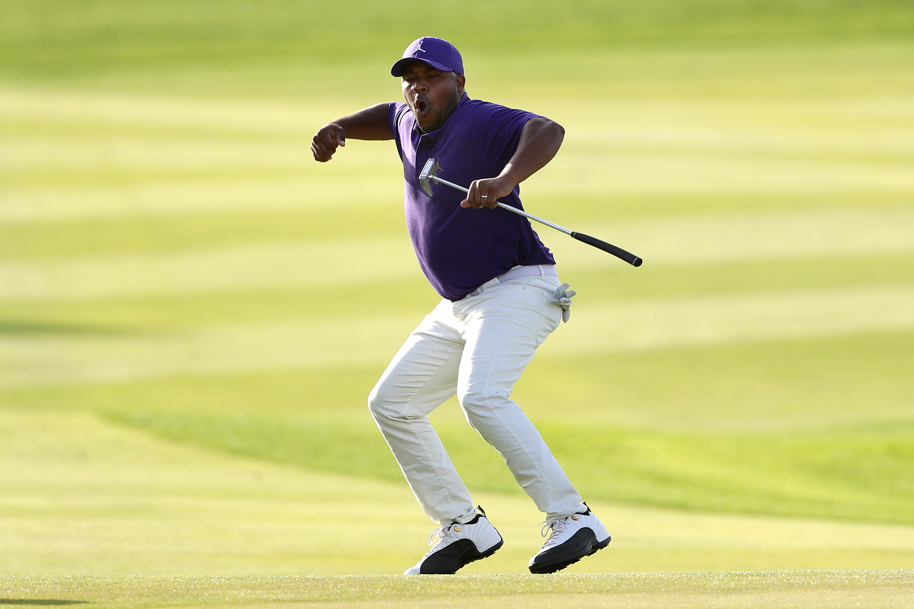 Harold Varner III celebrates after sinking an eagle putt on the 18th to win 