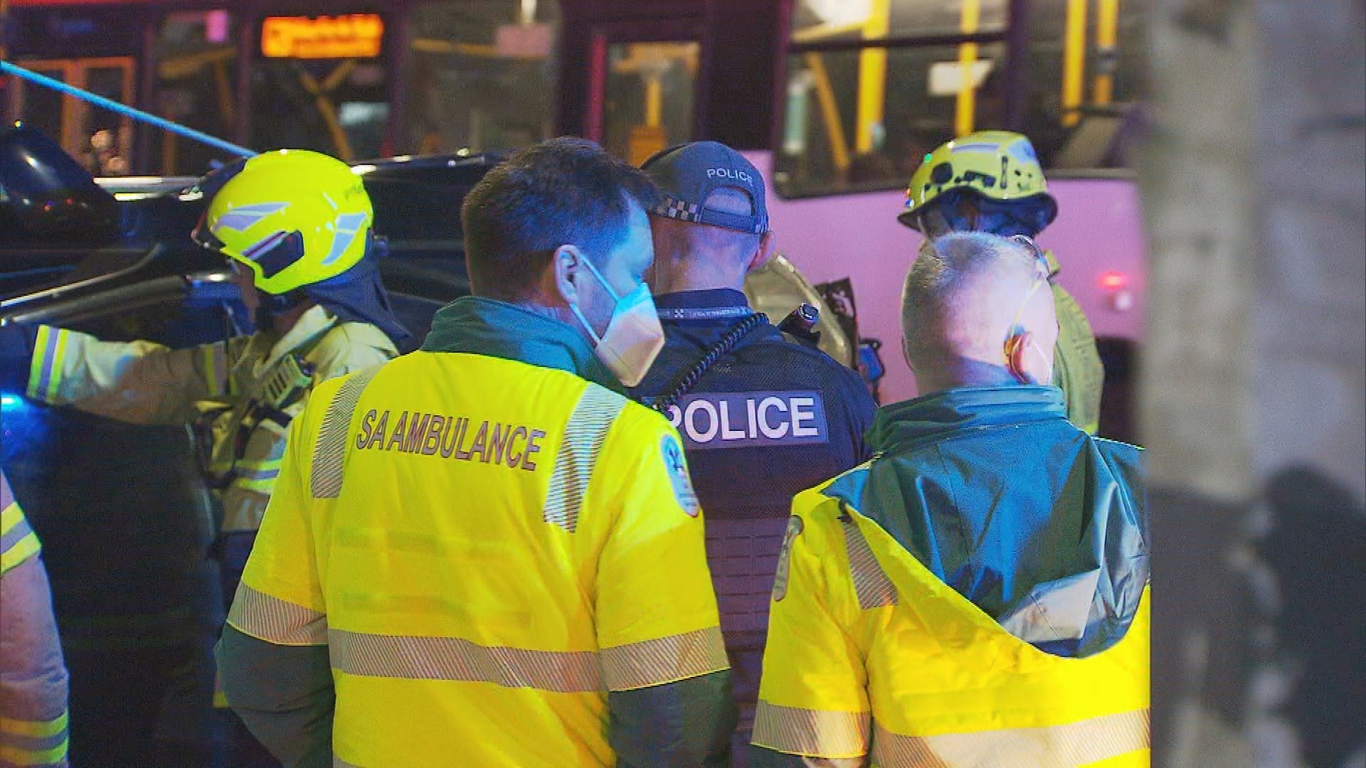 A woman has refused help by threatening emergency services with an axe after she became trapped in her crashed car in Adelaide.