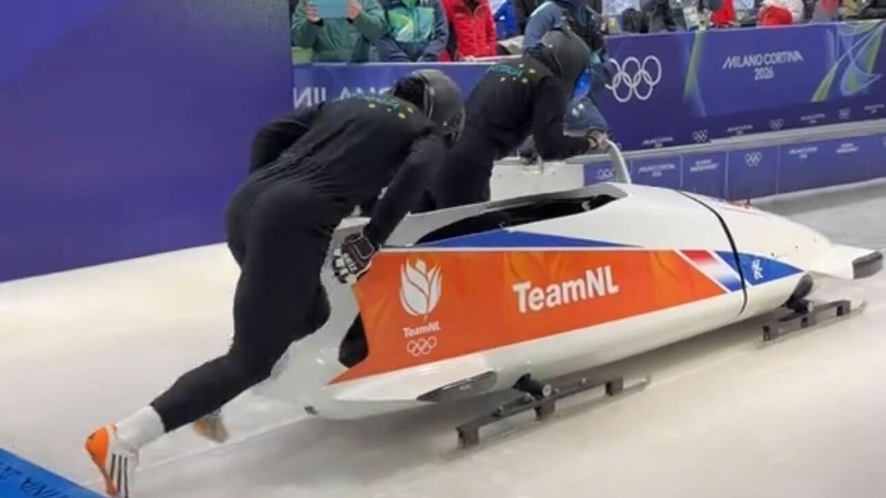 Sarah Blizzard and Desi Johnson in action on the ice at the Winter Olympics.