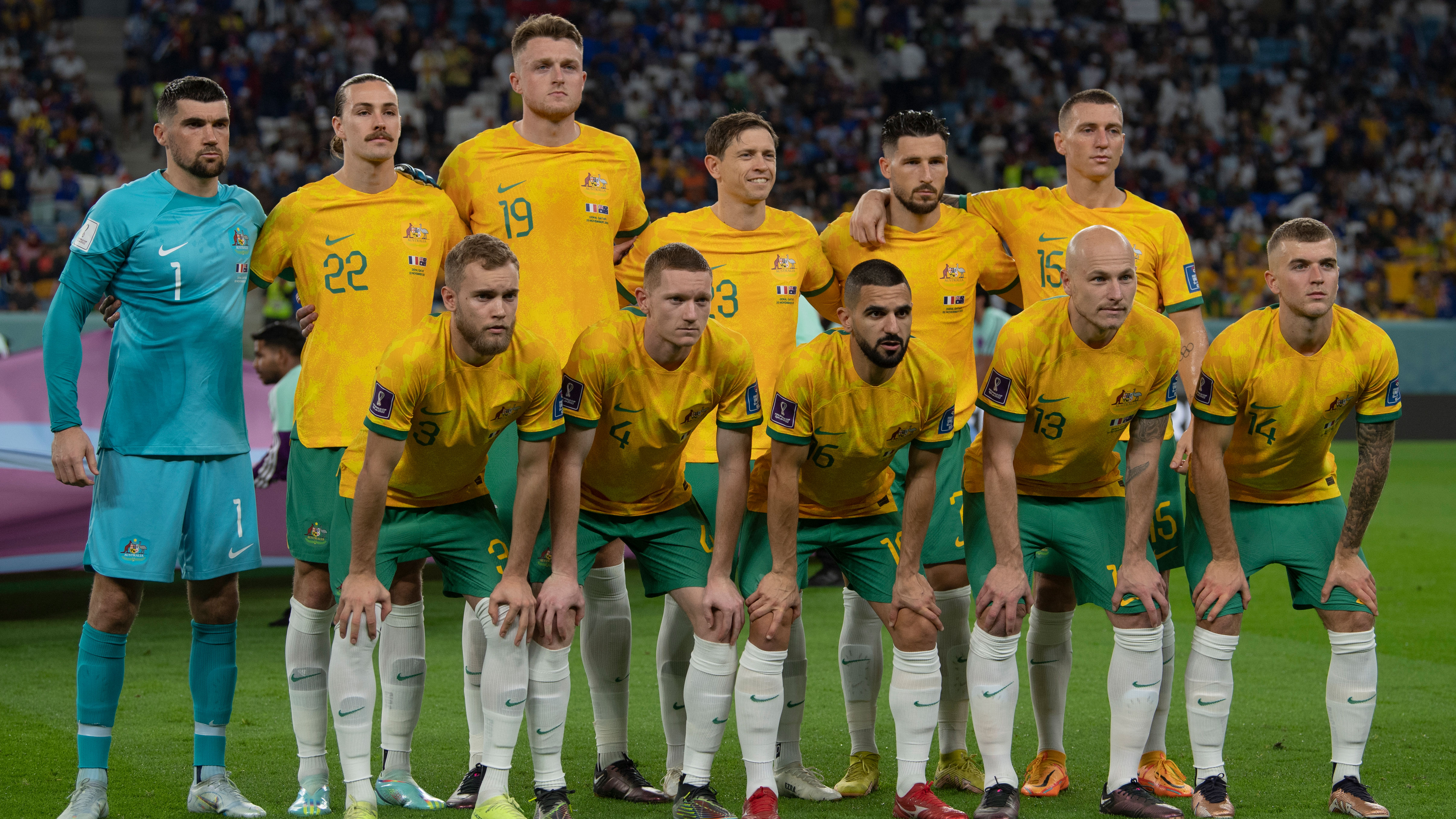 The Socceroos XI for their opening World Cup clash in Qatar poses for a team photo.