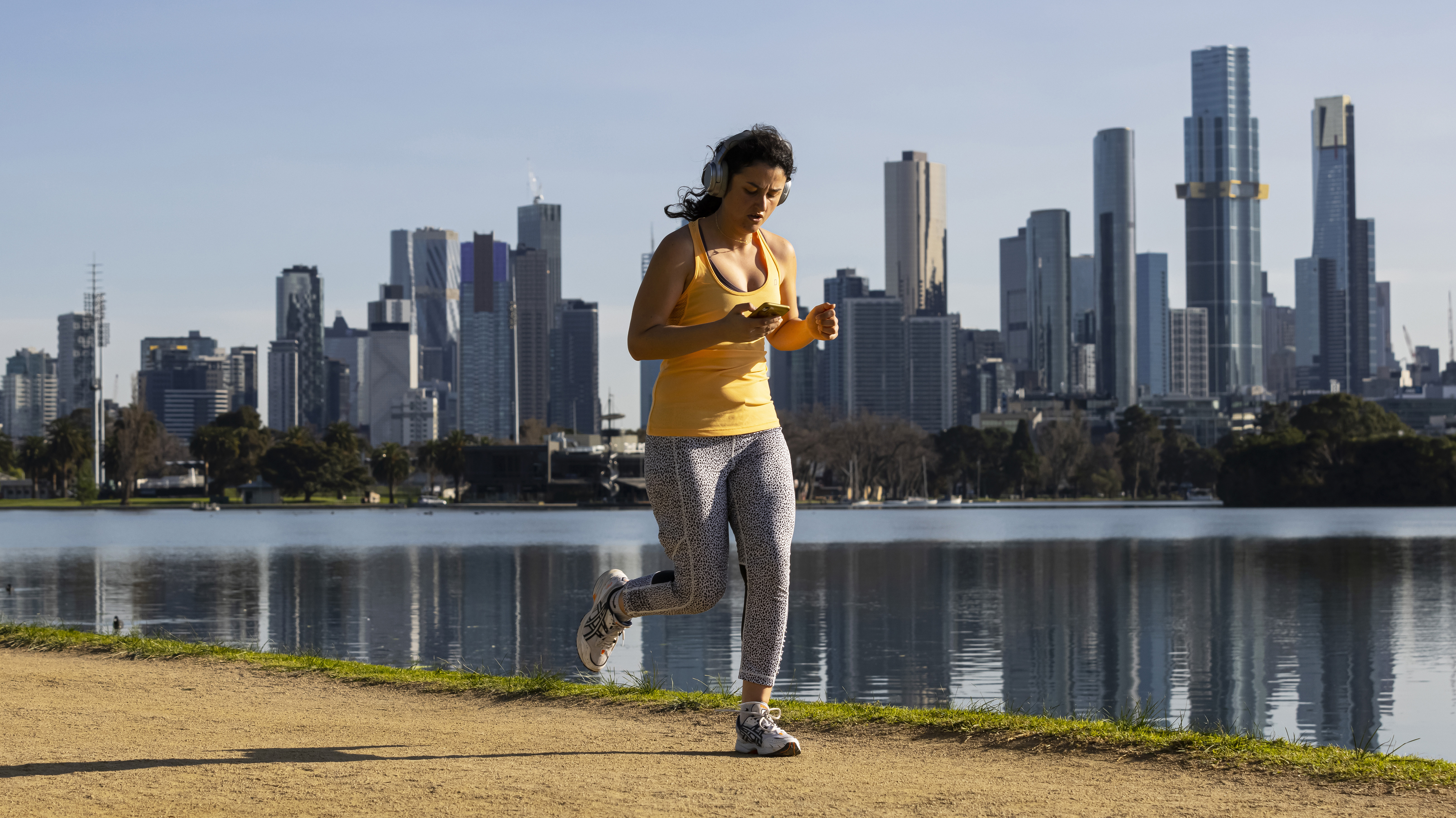 People exercising at Albert Park Lake in Melbourne