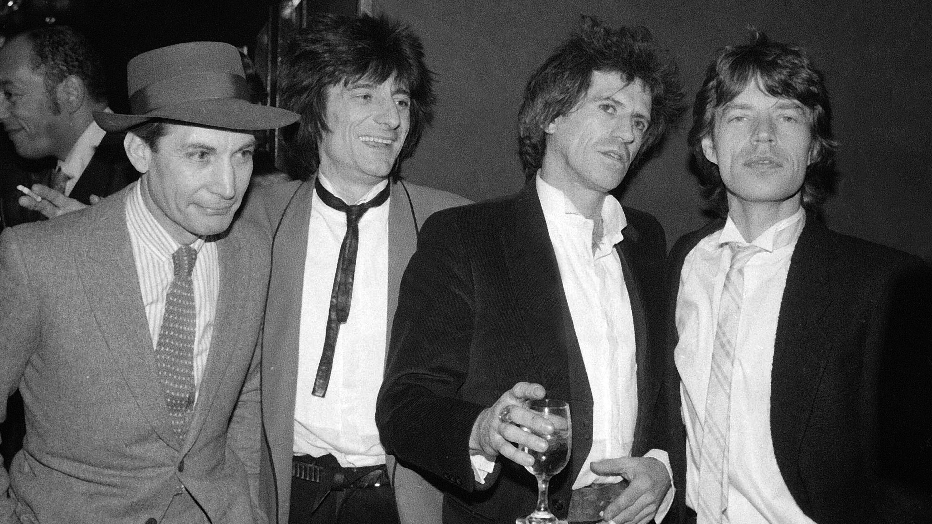 Members of the Rolling Stones, from left, Charlie Watts, Ron Wood, Keith Richards, and Mick Jagger appear at a party celebrating the opening of their film "Let's Spend The Night Together," in New York on Jan. 18, 1983. 