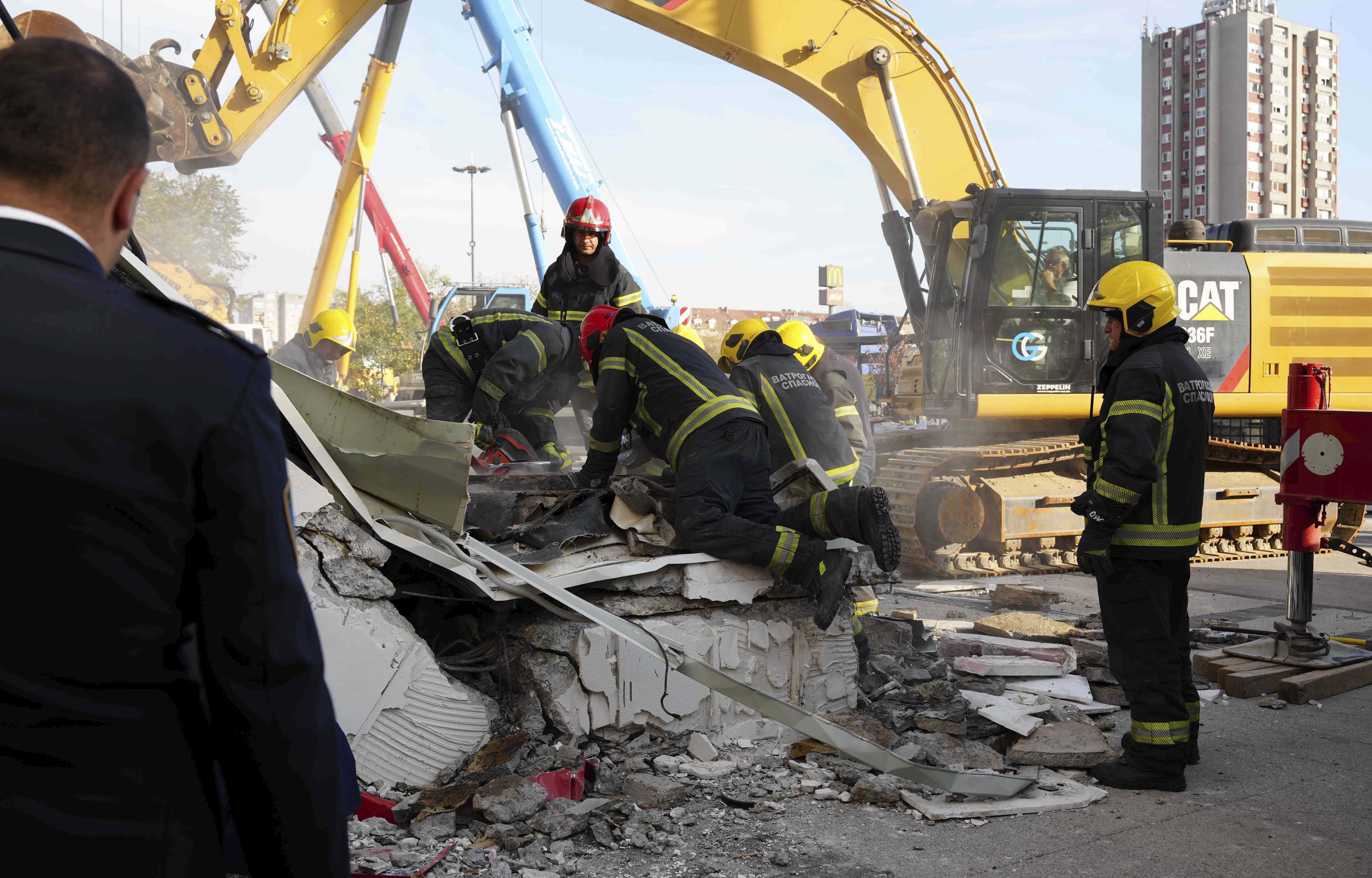 Rescue service workers inspect a scene as a roof collapsed at a railway station, Friday Nov. 1, 2024, in Novi Sad, Serbia. (Interior Ministry of Serbia via AP)