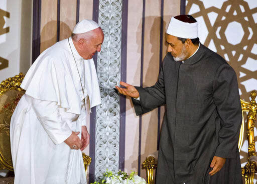 Sheikh Ahmed el-Tayeb, right, Grand Imam of Al-Azhar, the pre-eminent institute of Islamic learning in the Sunni Muslim world, right, welcomes Pope Francis at the international peace conference in Cairo, Egypt, Friday, April 28, 2017. 