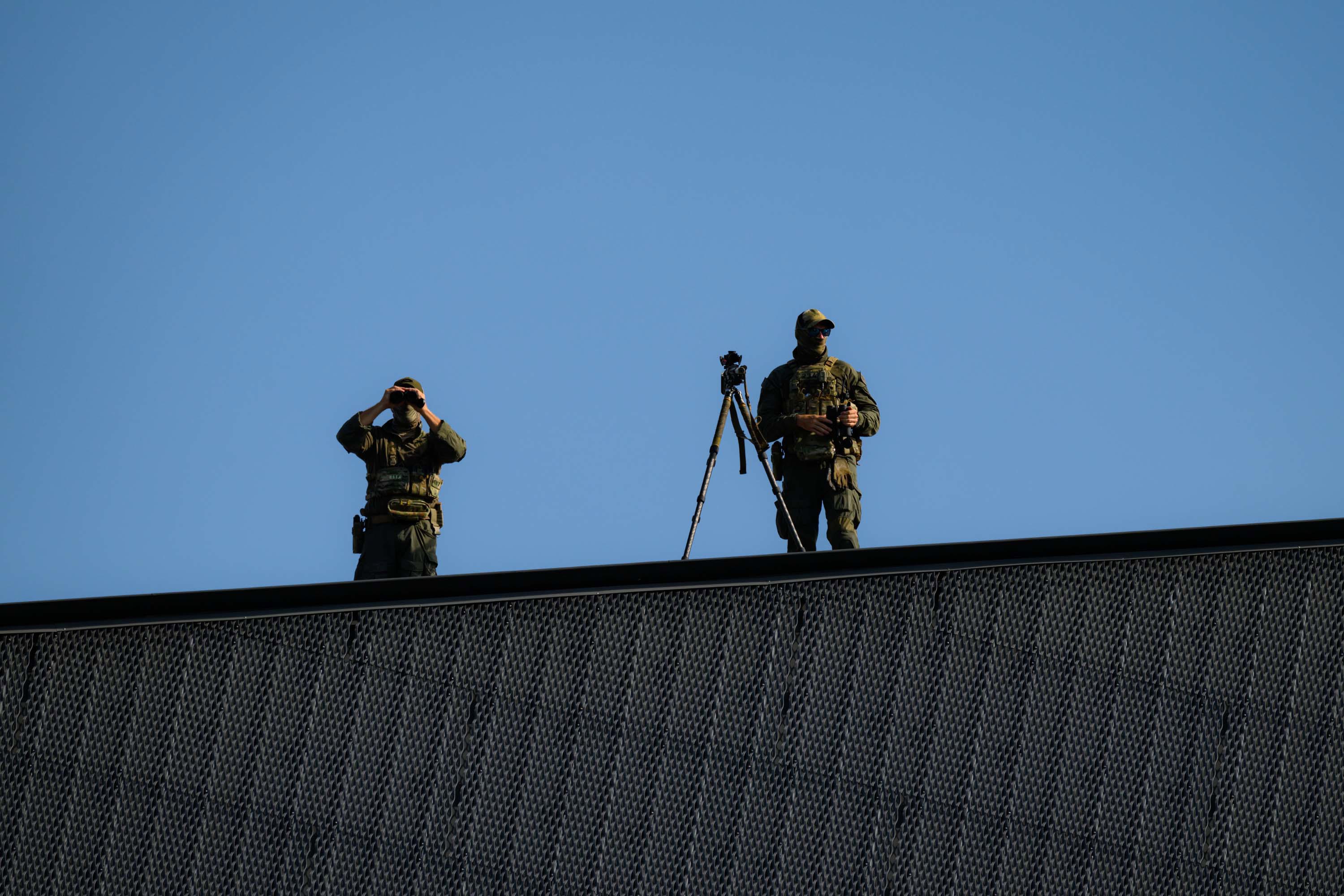 Snipers on guard on the roof of TikTok Entertainment Centre (formerly ICC Sydney Theatre) ahead of the An Evening of Light & Solidarity event.