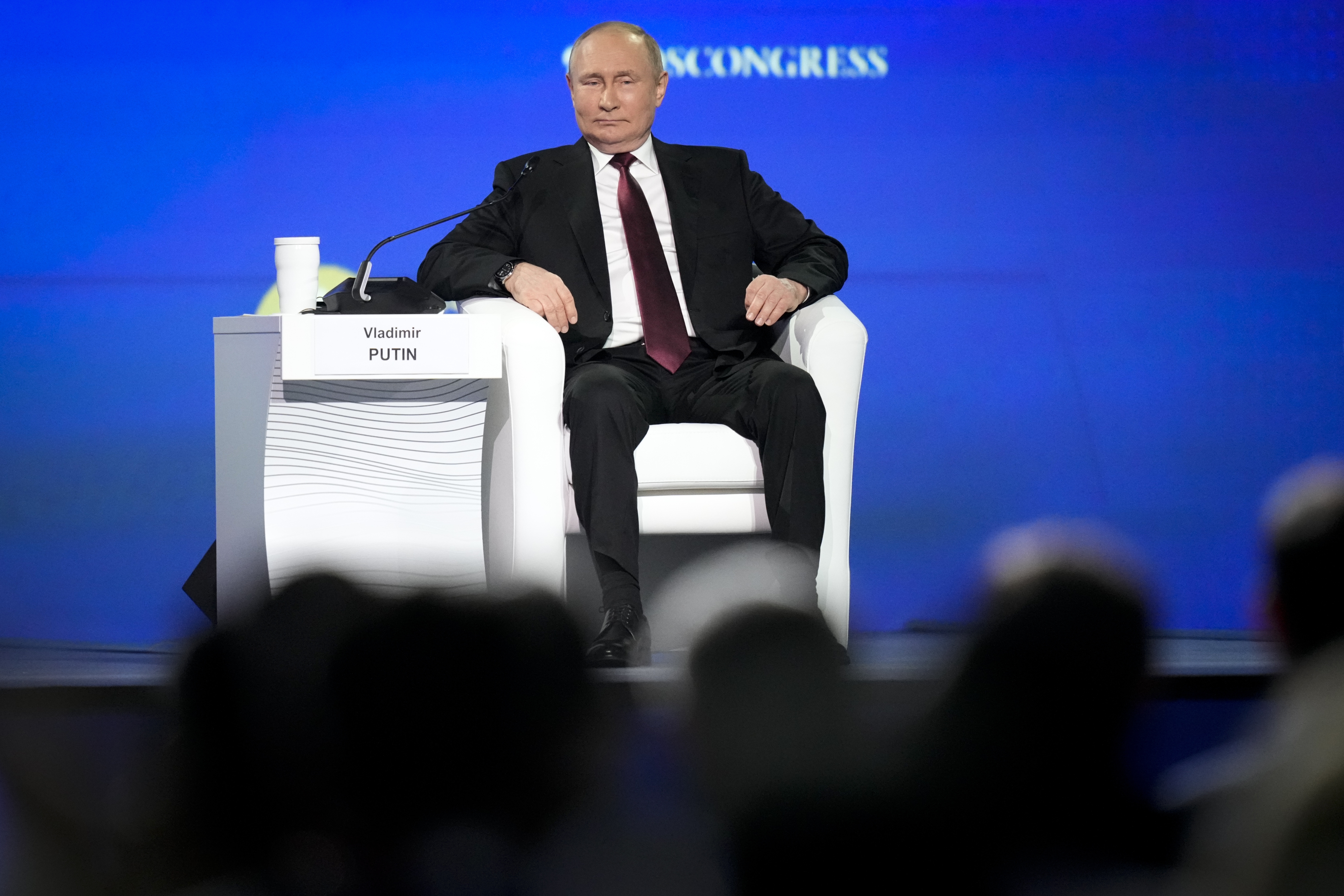 Russian President Vladimir Putin gestures attends a plenary session of the St. Petersburg International Economic Forum in St.Petersburg, Russia, Friday, June 17, 2022. (AP Photo/Dmitri Lovetsky)