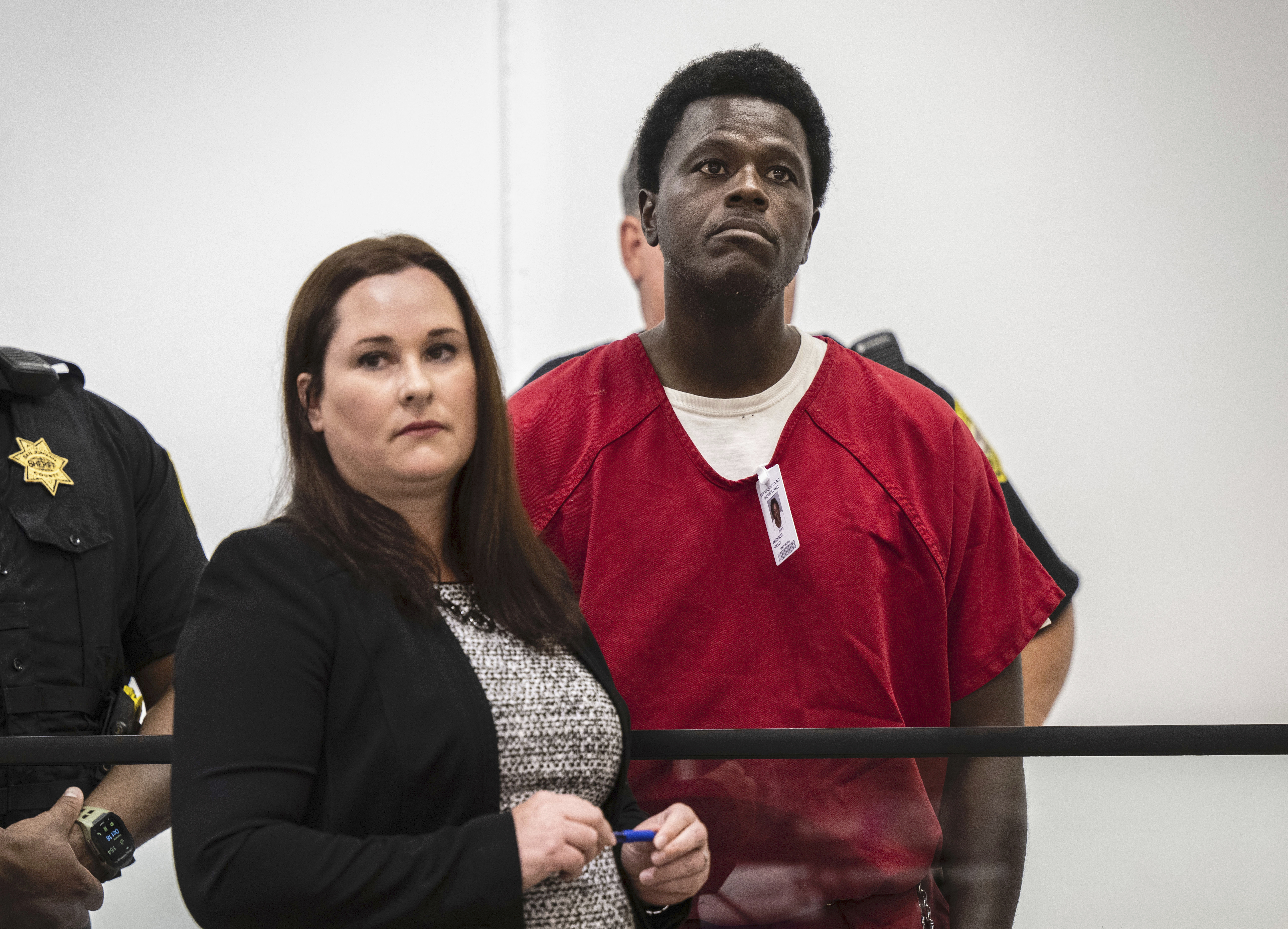 Wesley Brownlee stands with public defender Allison Nobert during his arraignment in San Joaquin County Superior Court on Tuesday, Oct. 18, 2022. Prosecutors have charged Brownlee with fatally shooting three men whom police have said were among six victims slain by a serial killer over the past year and a half. (Hector Amezcua/The Sacramento Bee via AP)