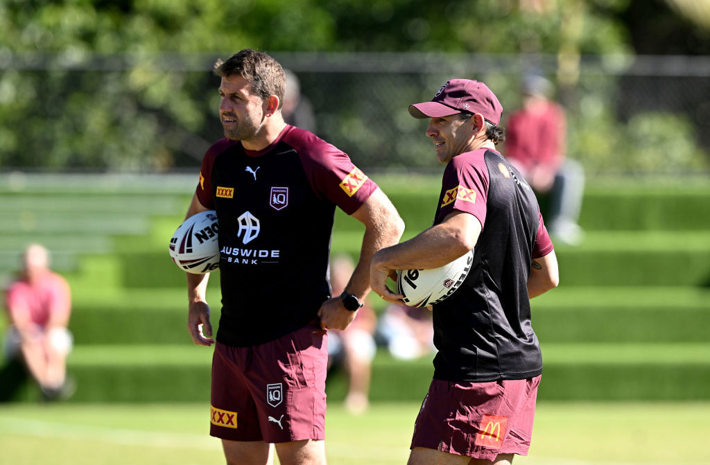 Coach Billy Slater is seen chatting with Assistant Coach Josh Hannay.