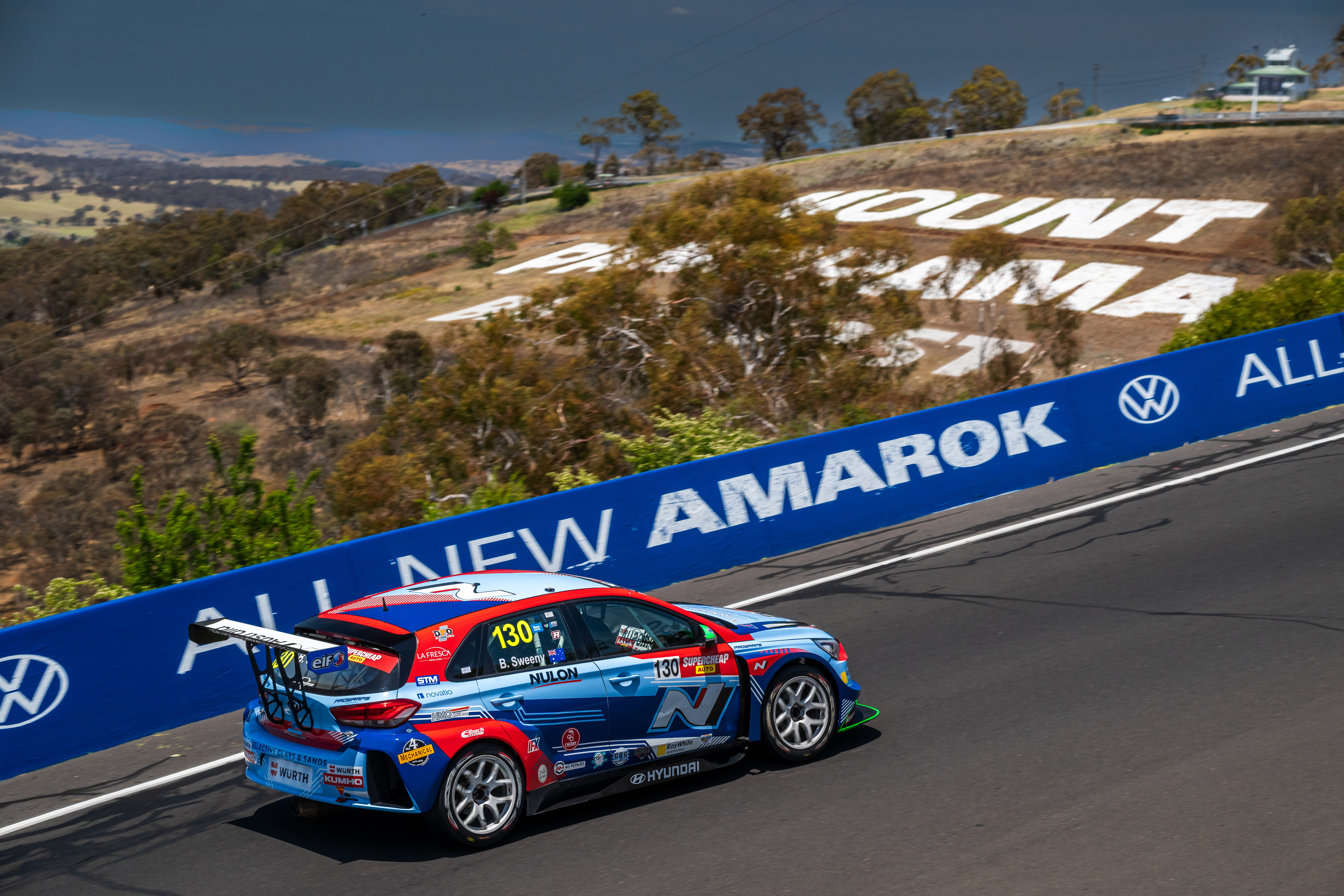 Bailey Sweeny crests the top of Mount Panorama in his Hyundai i30 N. 