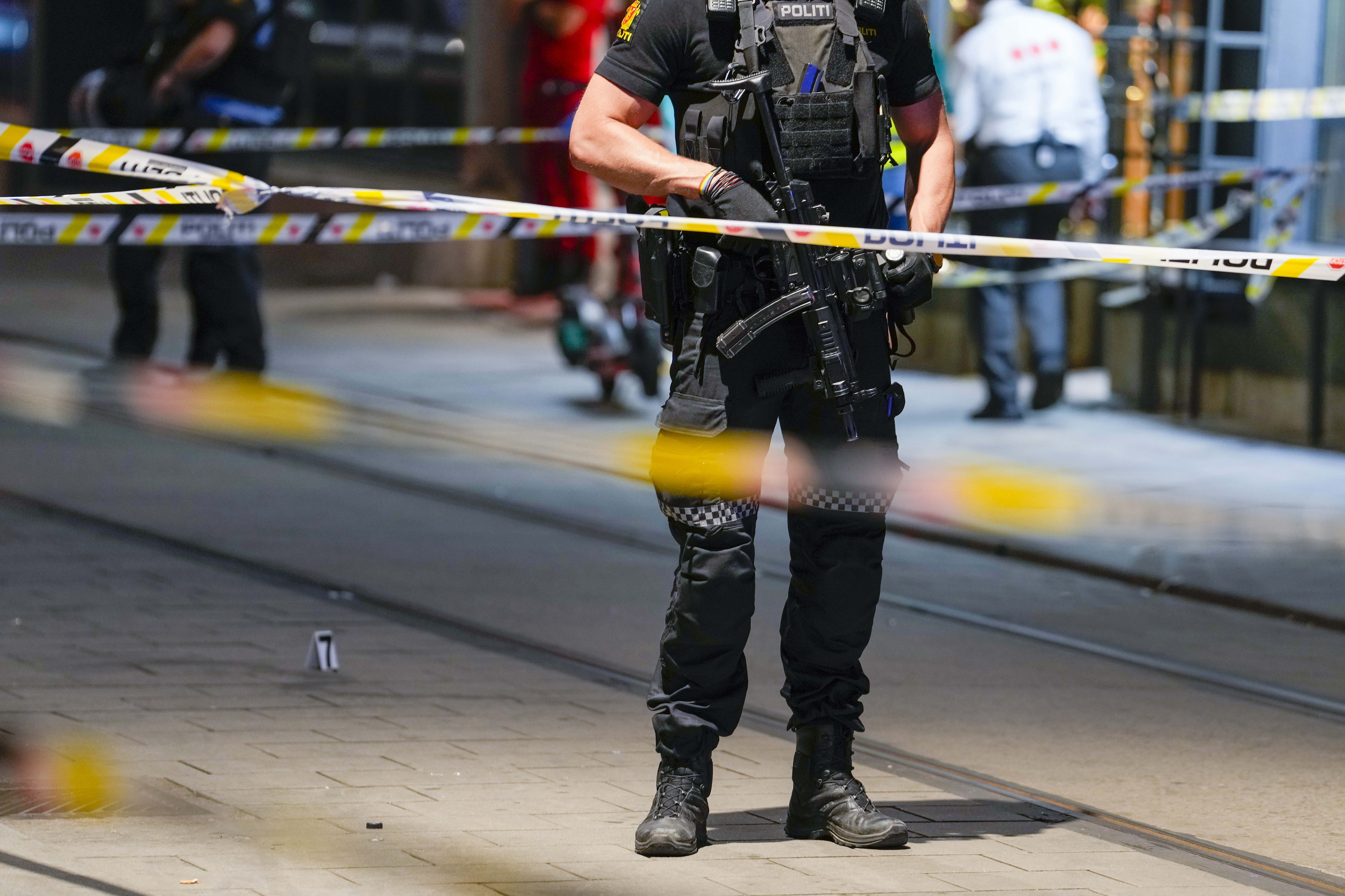 Police gather at the site of a mass shooting in Oslo, early Saturday, June 25, 2022. Norwegian police say a few people have been killed and more than a dozen injured in a mass shooting. (Javad Parsa/NTB via AP)