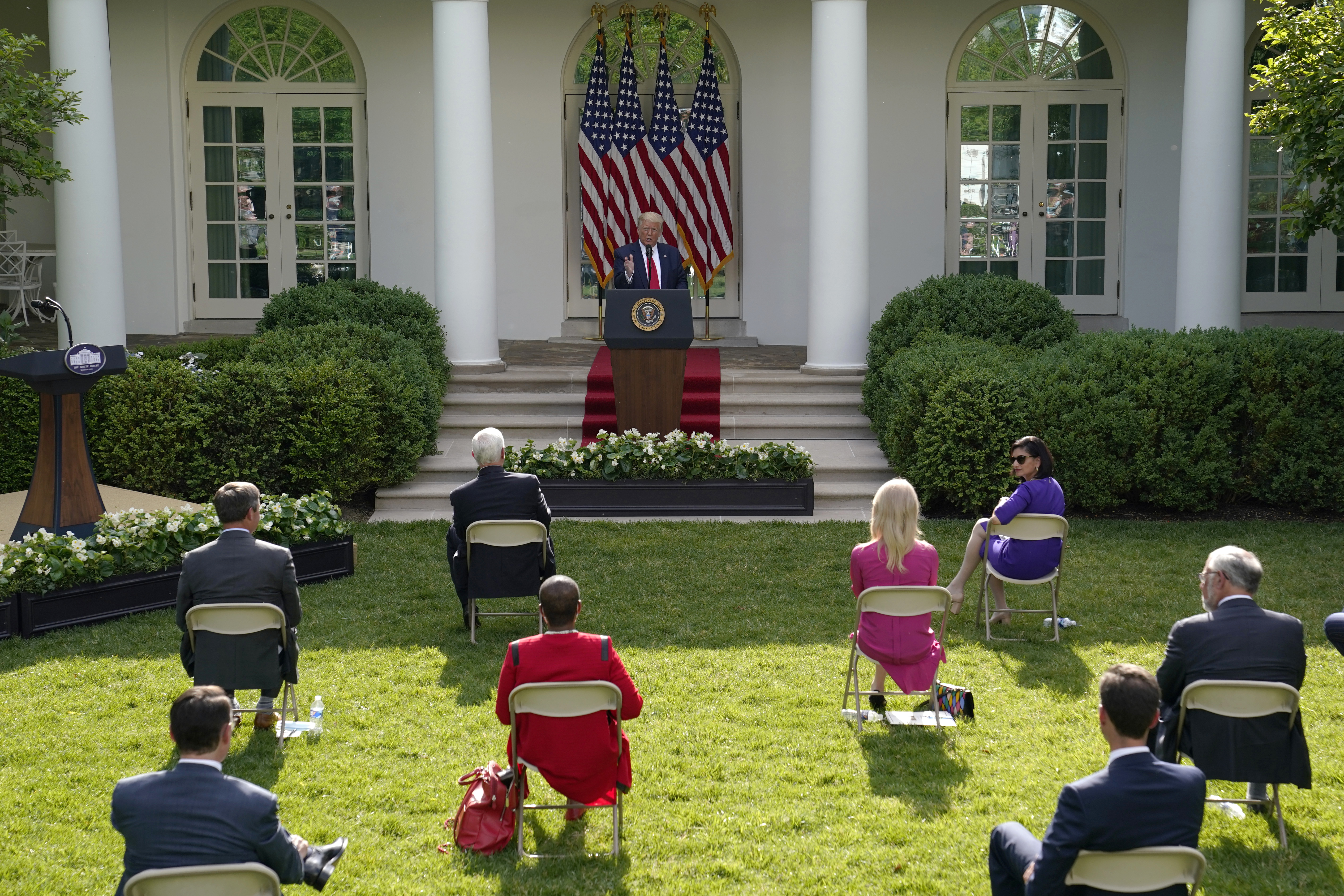 President Donald Trump answers questions from reporters in the Rose Garden at the White House.