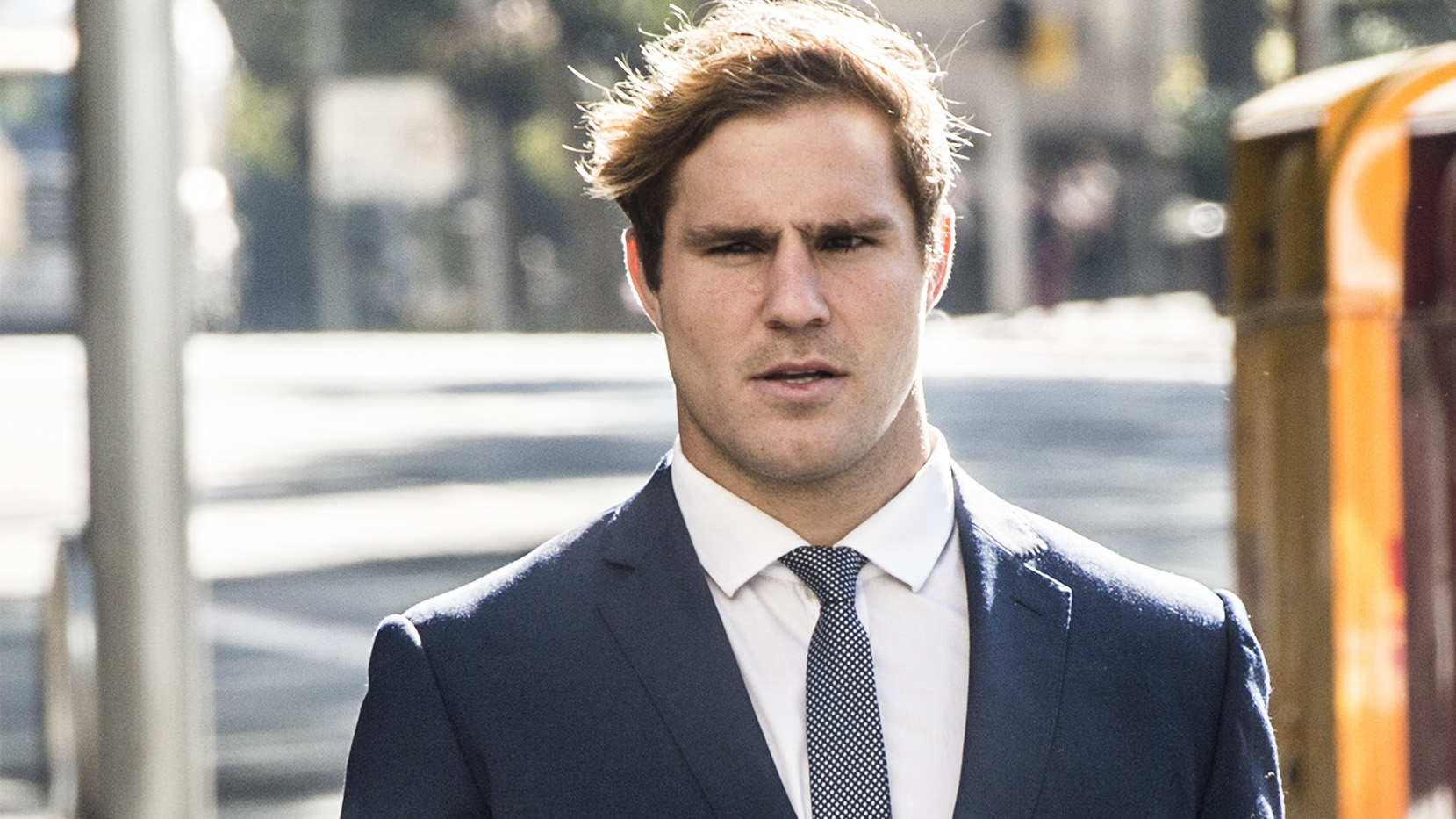 Jack de Belin arrives at Downing Centre Local & District Court in Sydney.