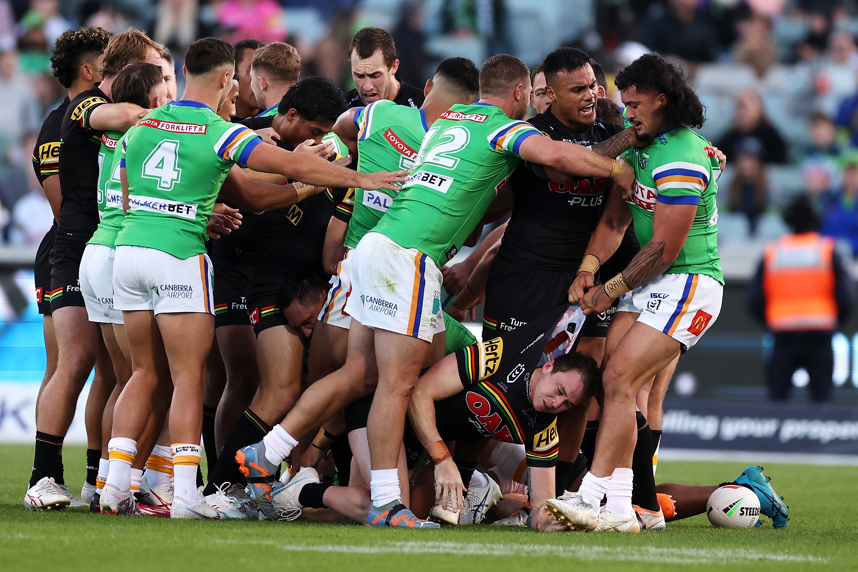 Raiders and Panthers players scuffle at GIO Stadium.