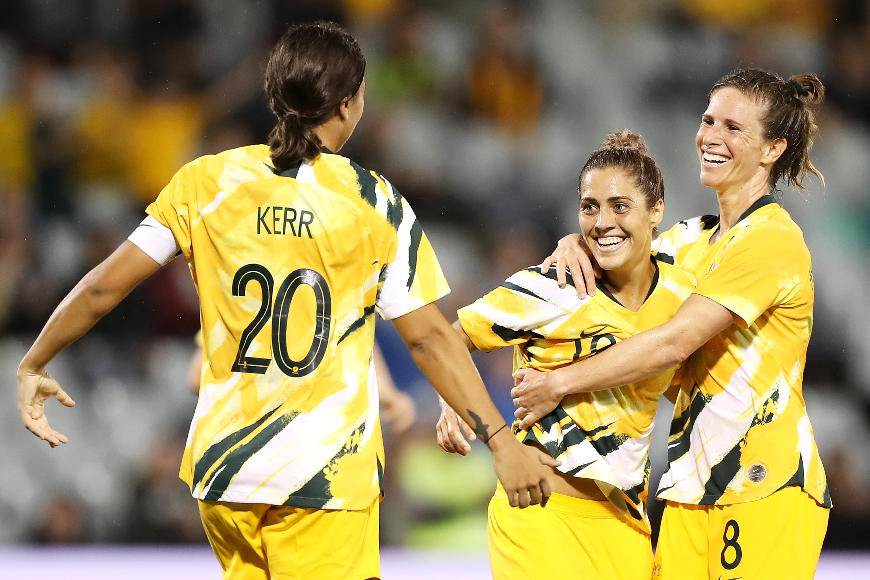 Katrina Gorry of the Matildas celebrates with her teammates Sam Kerr and Elise Kellond-Knight of the Matildas after scoring a goal during the Women's Olympic Football Tournament Qualifier match in 2020.