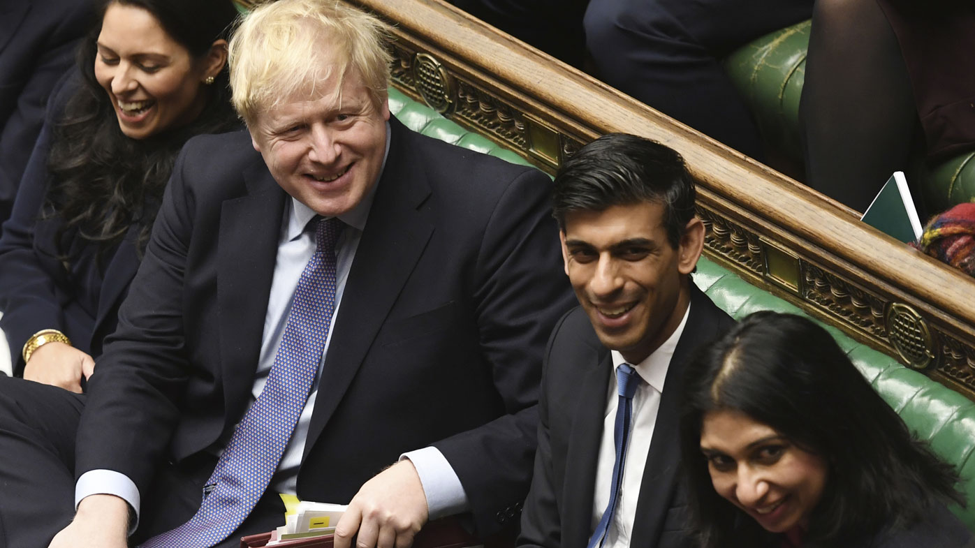 Prime Minister Boris Johnson, 3rd from right, during the weekly Prime Minister's Questions at the House of Commons in London, Wednesday Feb. 26, 2020. Chancellor of the Exchequer Rishi Sunak, 2nd right, and Home Secretary Priti Patel, left.