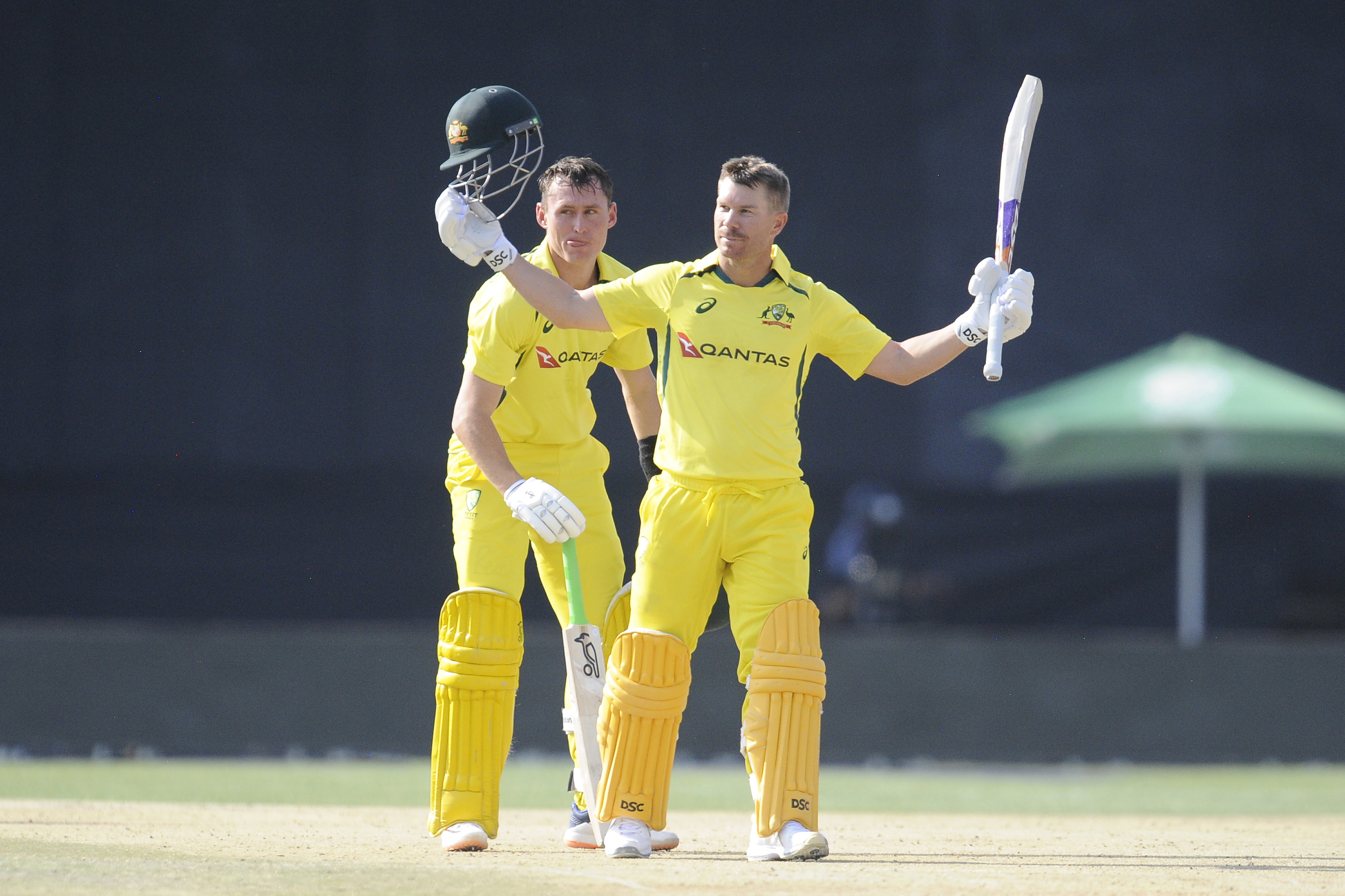 David Warner celebrates scoring a century during the second ODI match between South Africa and Australia at Mangaung Oval.