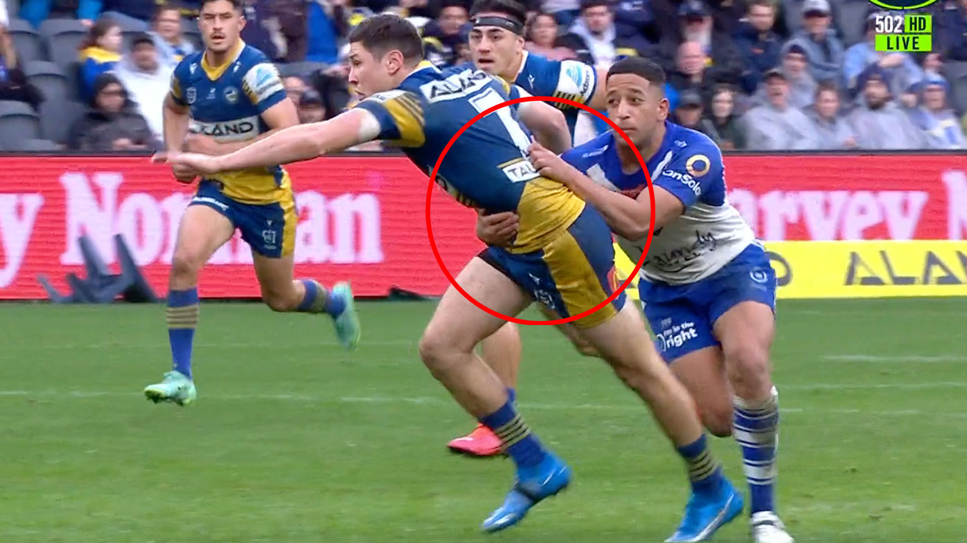 Brandon Wakeham holds back Mitchell Moses