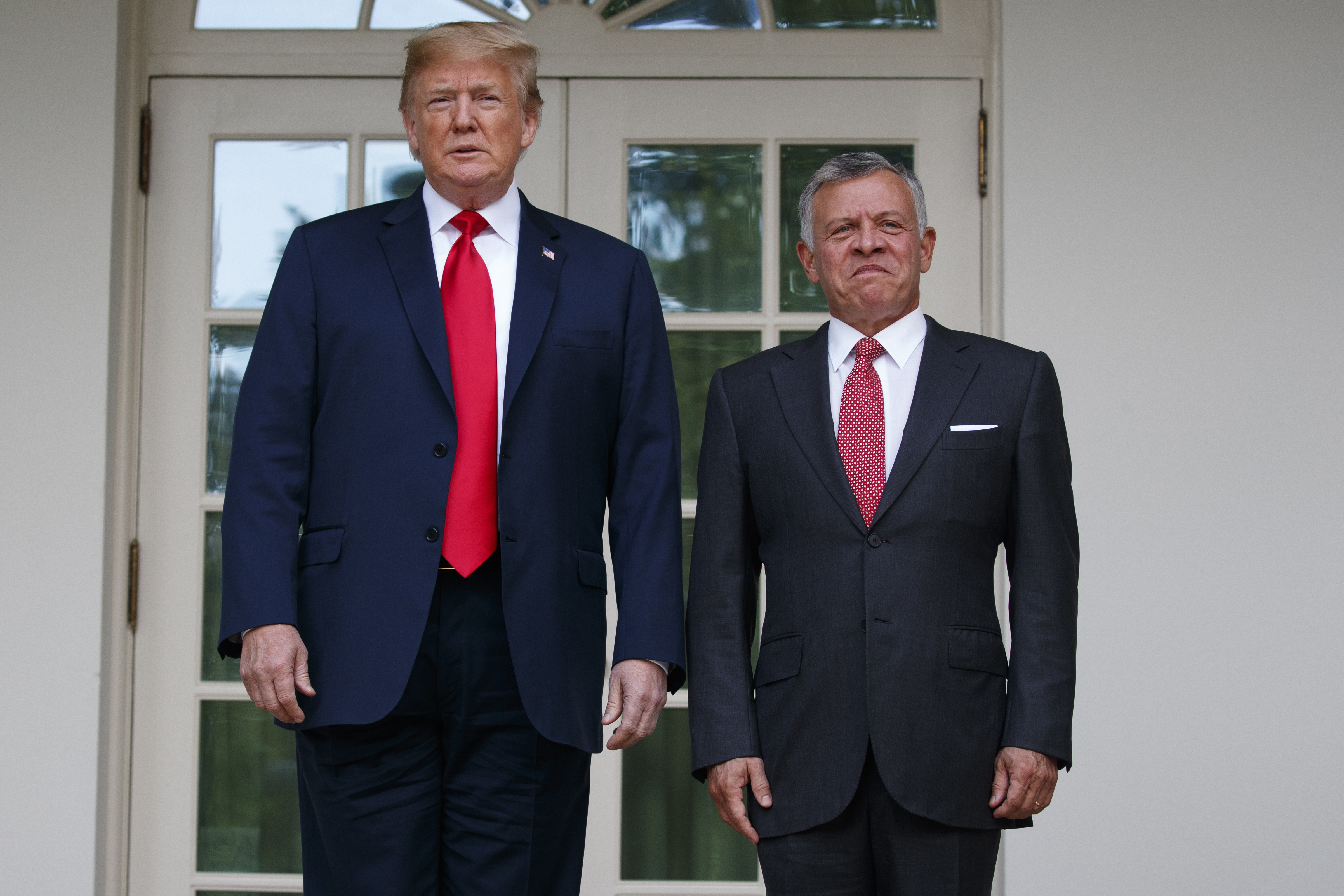 US President Donald Trump stands with Jordan's King Abdullah II 