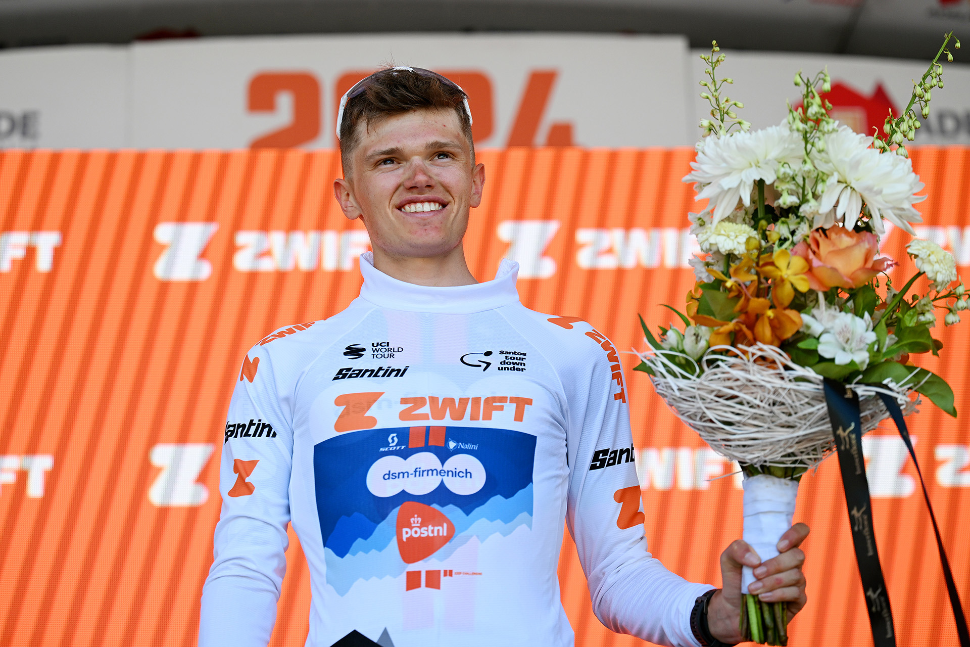 Oscar Onley of United Kingdom and Team dsm-firmenich PostNL celebrates at podium as White best young jersey winner during the 24th Santos Tour Down Under 2024, Stage 5 a 129.3km stage from Christies Beach to Willunga Hill 372m.