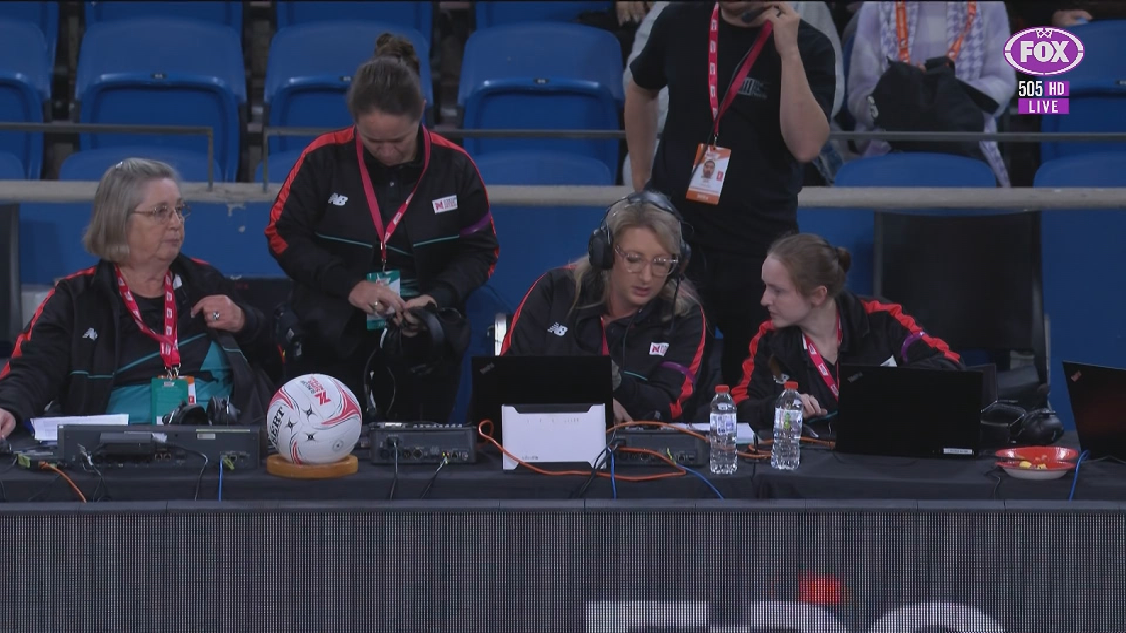 Officials conducting a score check after mistakenly awarding the Lightning a one-point Super Netball victory over the Giants. The match was actually a draw.