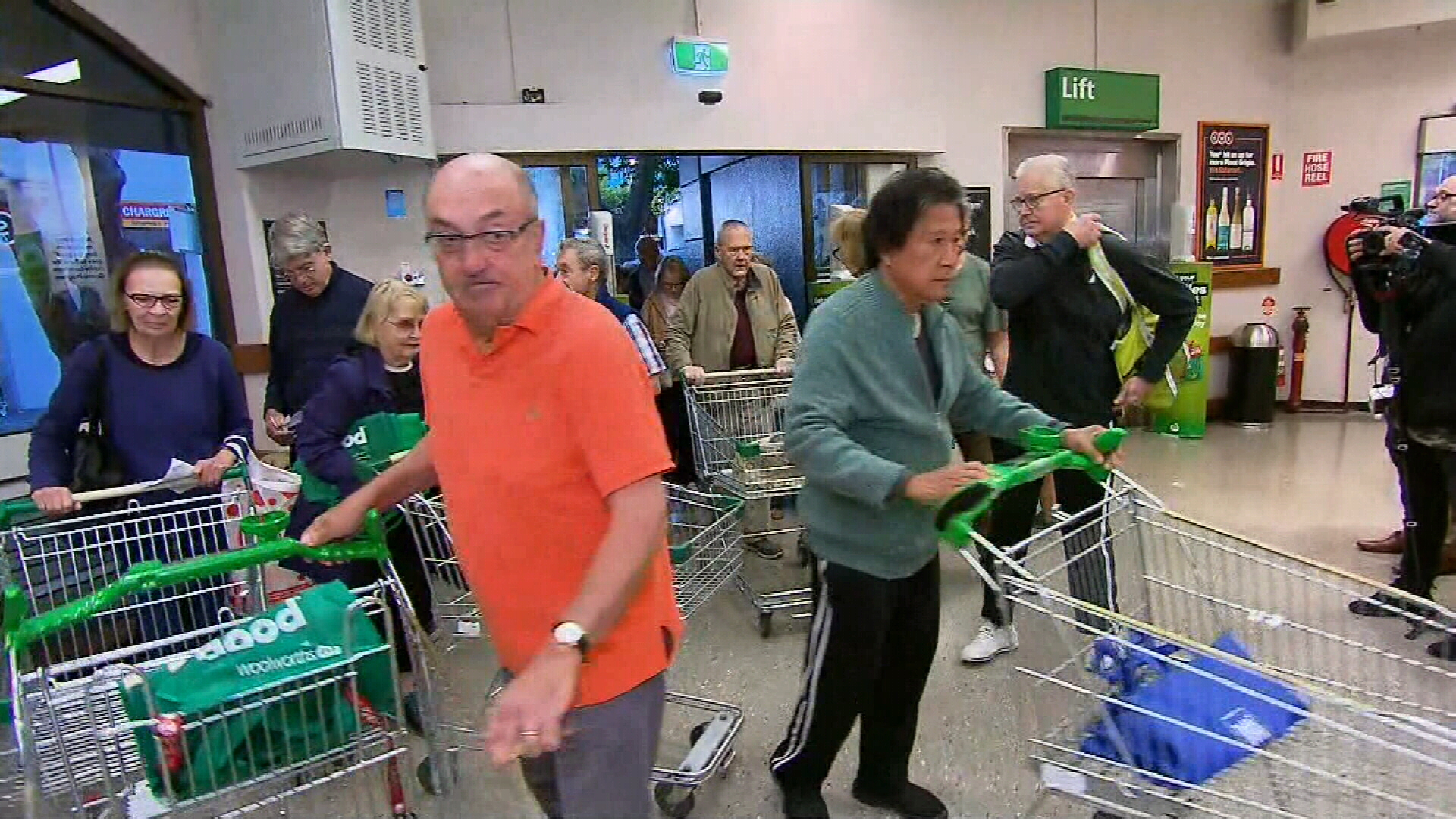 Elderly and disabled members of the community arrive at Woolworths for their dedicated shopping hour. 