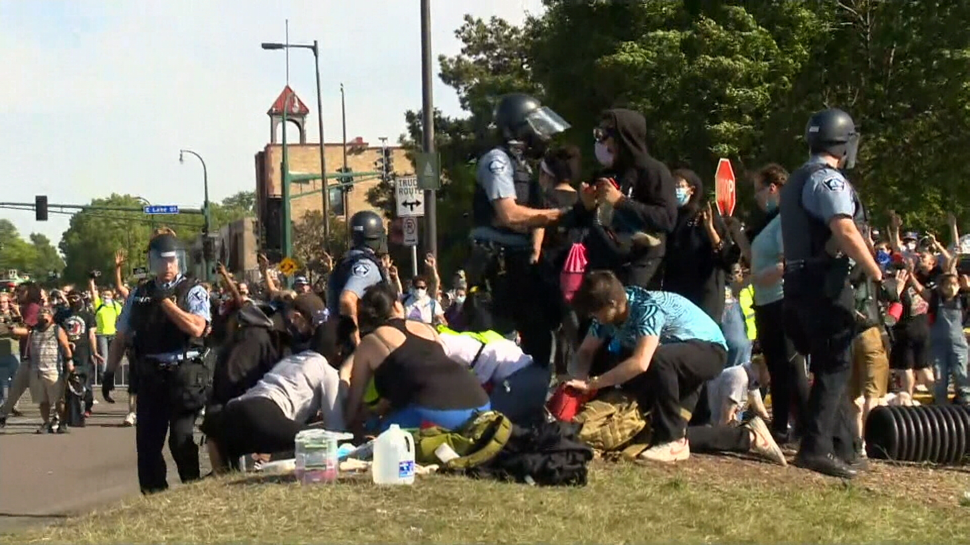 Onlookers treat a man who was stabbed during the chaos.