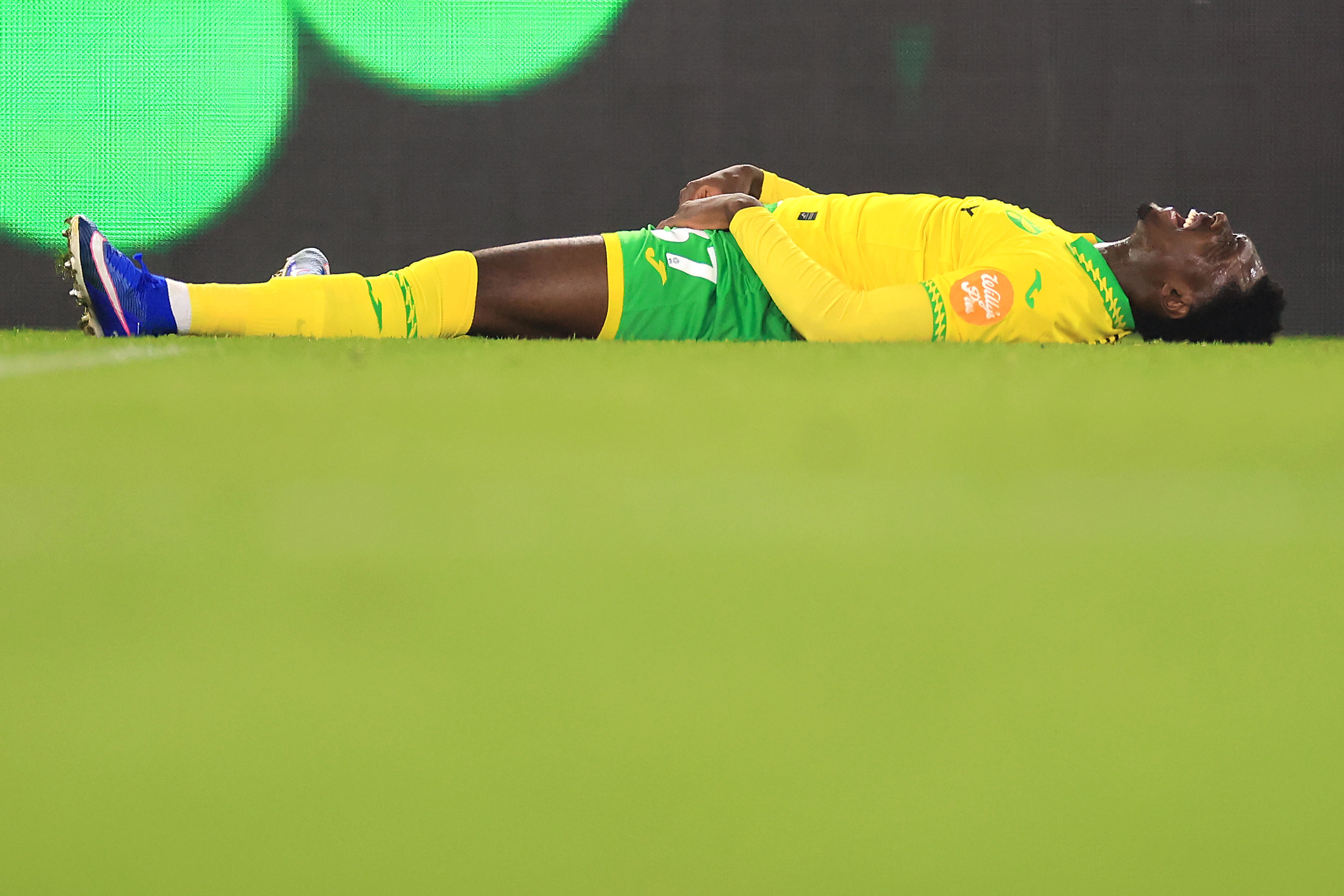NORWICH, ENGLAND - FEBRUARY 25: Mohamed Toure of Norwich City lies on the floor prior to leaving the field injured during the Sky Bet Championship match between Norwich City and Sheffield Wednesday at Carrow Road on February 25, 2026 in Norwich, England. (Photo by Stephen Pond/Getty Images)