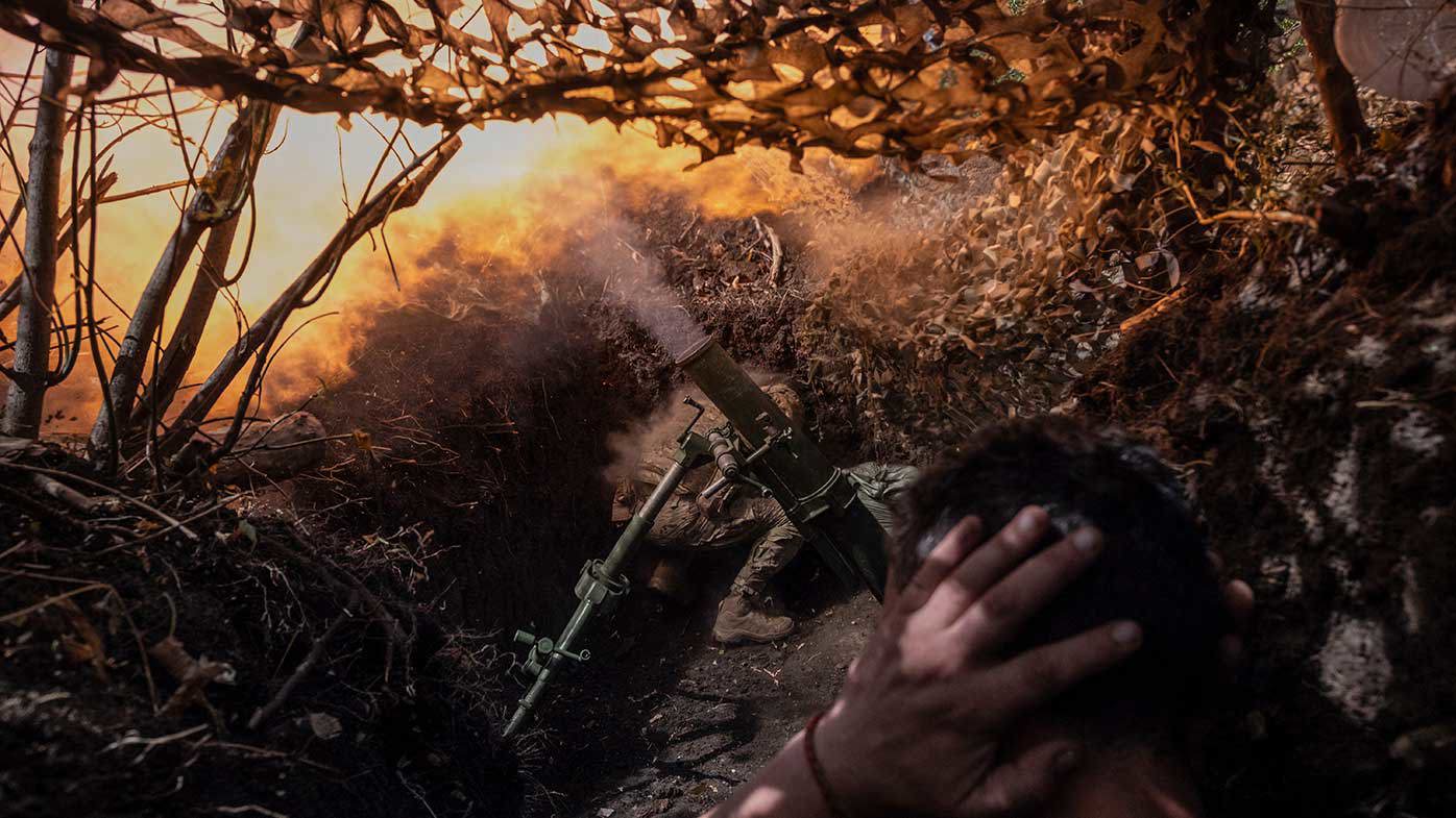 Soldiers fire a mortar towards positions of Russian troops near Kostyantynivka in Donetsk region.