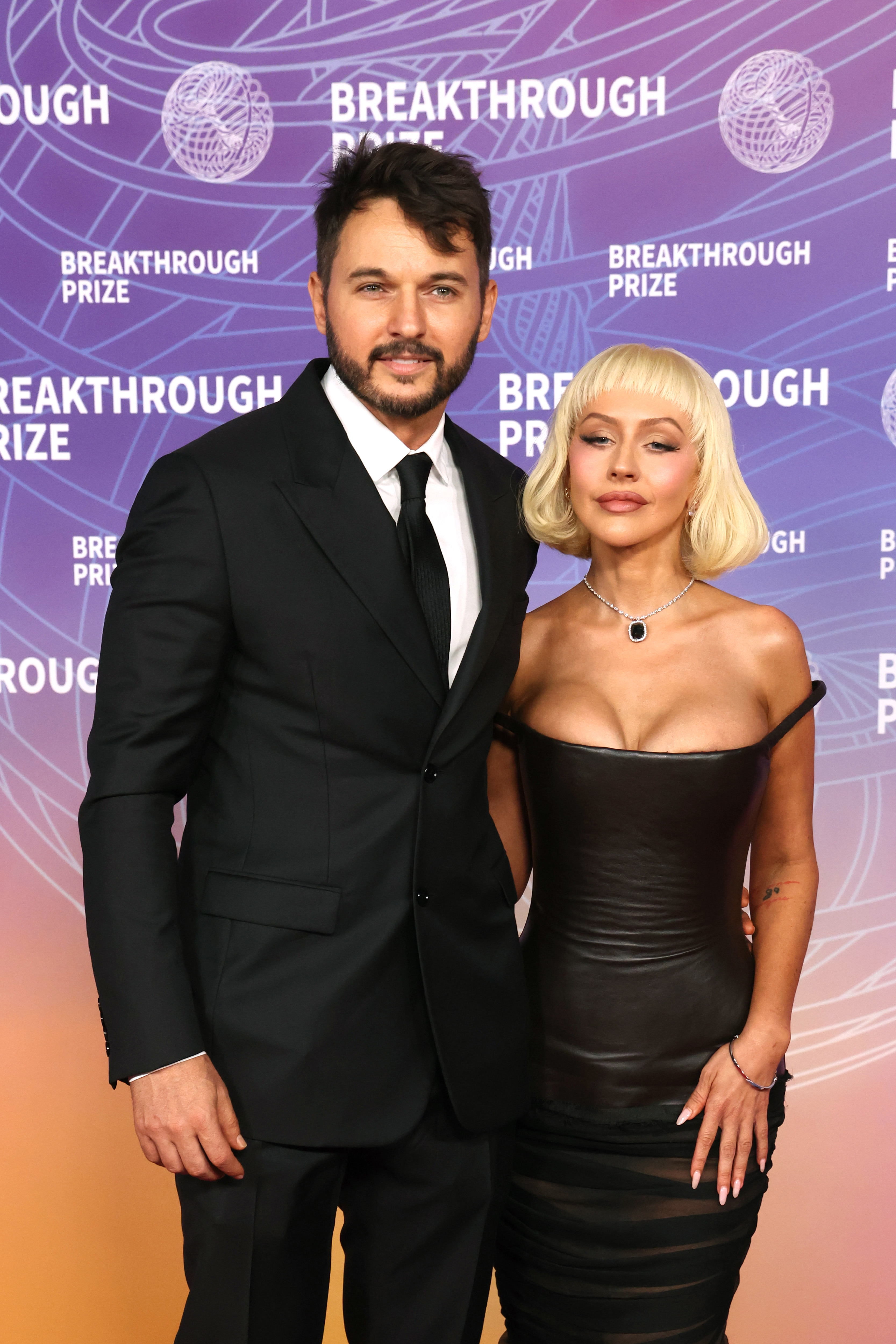 Matthew Rutler and Christina Aguilera attend the 12th Breakthrough Prize Ceremony at Barker Hangar on April 18, 2026 in Santa Monica, California. 