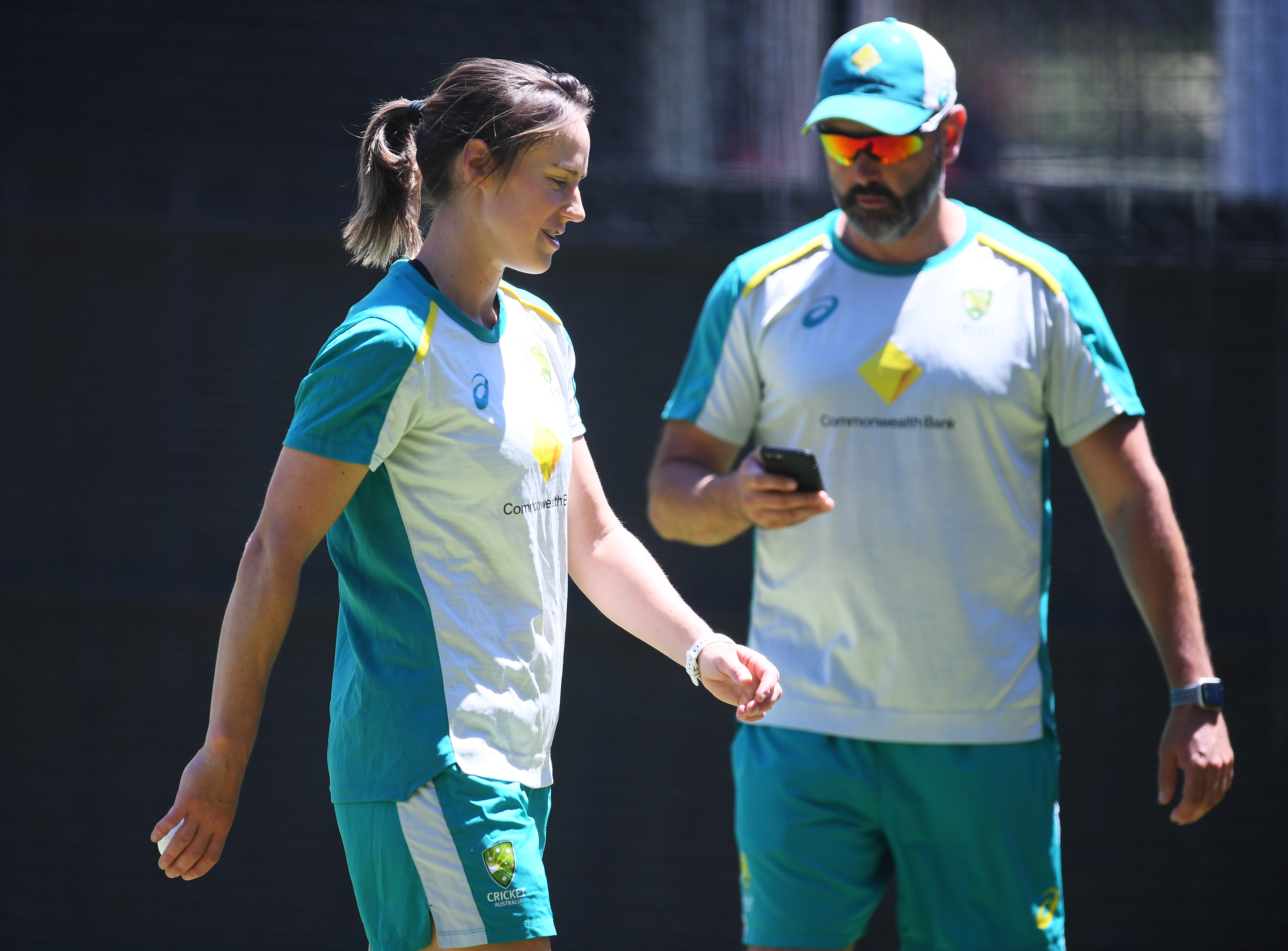 Ellyse Perry of Australia works on her bowling with bowling coach Ben Sawyer.