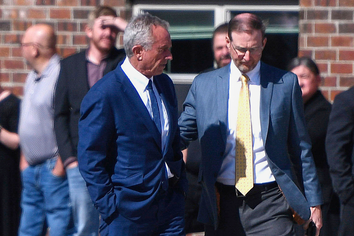 Health and Human Services Secretary Robert F. Kennedy Jr., left, stands with Dr. Ben Edwards, right, outside the Reinlander Mennonite Church in Seminole, Texas, on Sunday, April 6, 2025, after a second measles death. (AP Photo/Annie Rice, File)